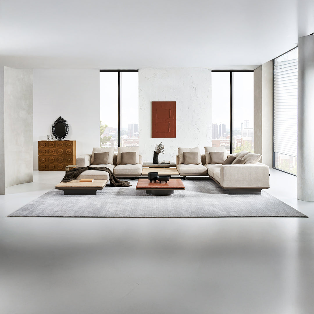 Avenor BEACON modular pouf with integrated side table, modern design, soft fabric upholstery, and functional surface.