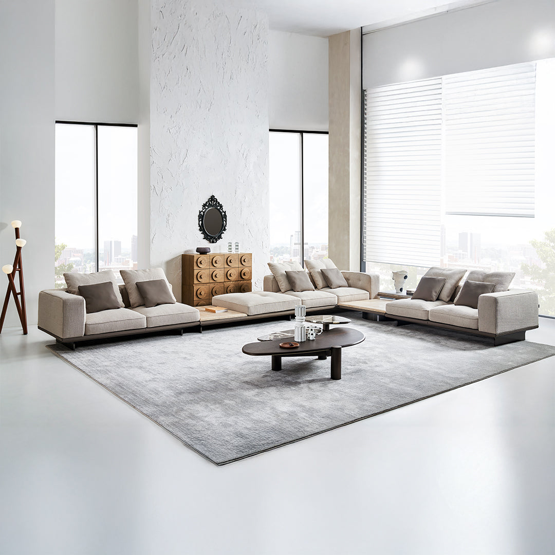 Avenor modular pouf with attached side table, beige fabric, and wooden legs, designed for versatile living room use.