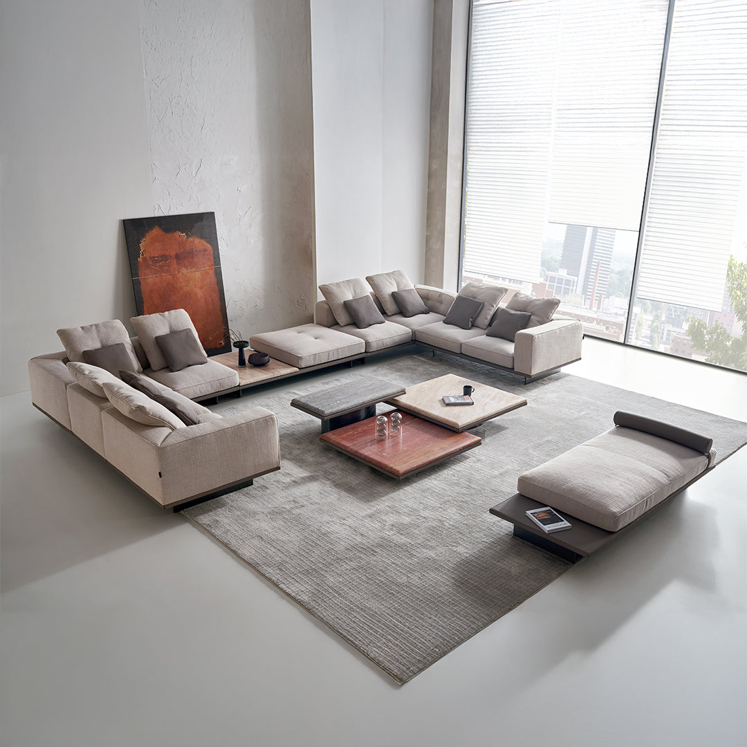 Avenor modular pouf with integrated side table from BEACON, shown as a versatile living room accent with soft fabric and modern design.