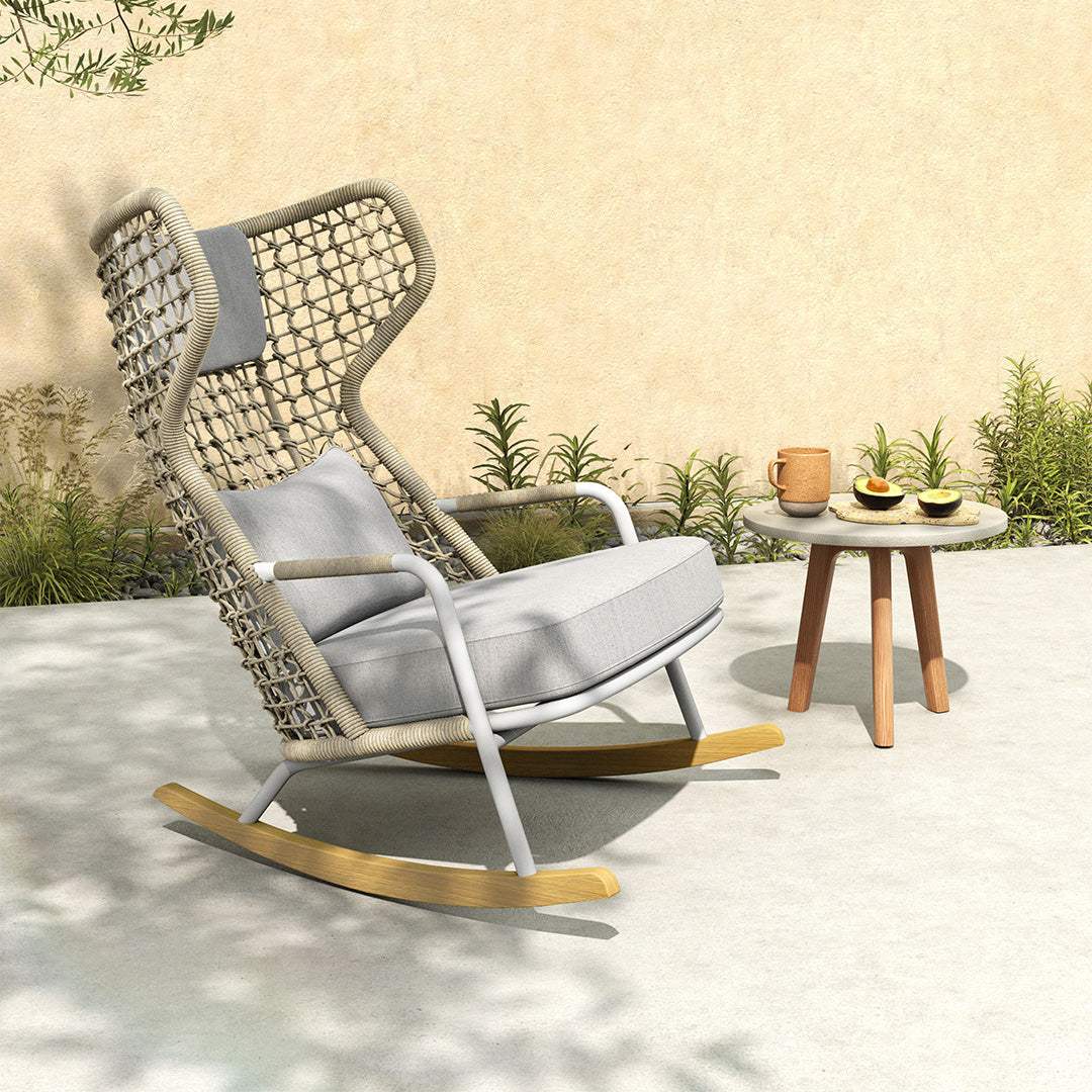 BEACON Banyan outdoor and indoor rocking armchair with wooden frame and cushioned seat, ideal for relaxing indoors or outdoors.