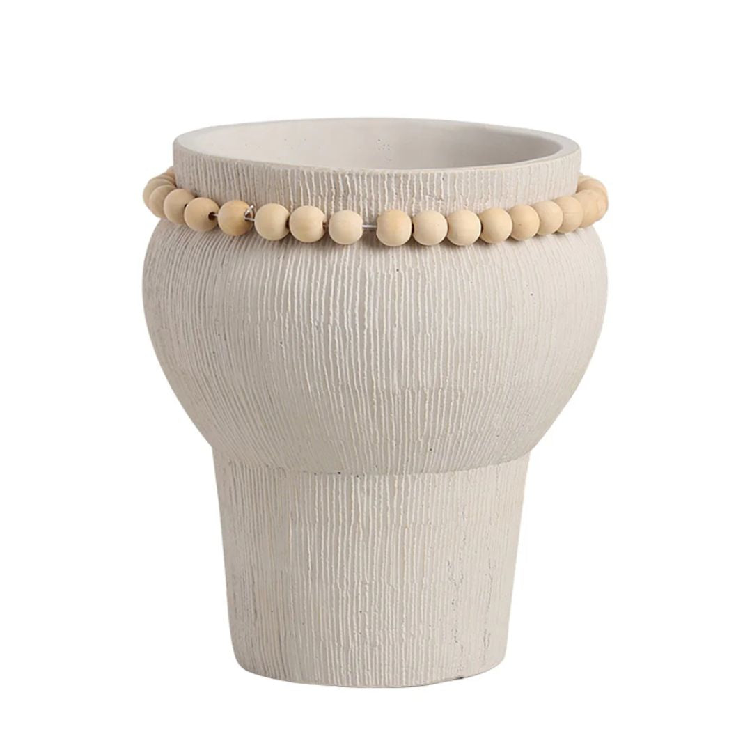 Beige cement vase with bead detail, designed by BEACON, perfect for modern home decor and floral arrangements.