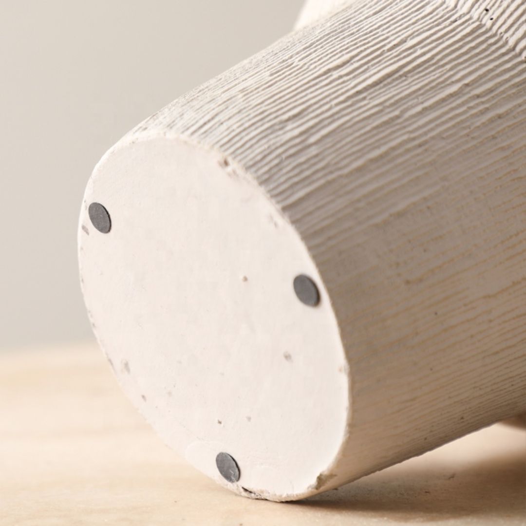 Beige cement vase with bead detail, decorative home decor from BEACON, suitable for flowers or display.