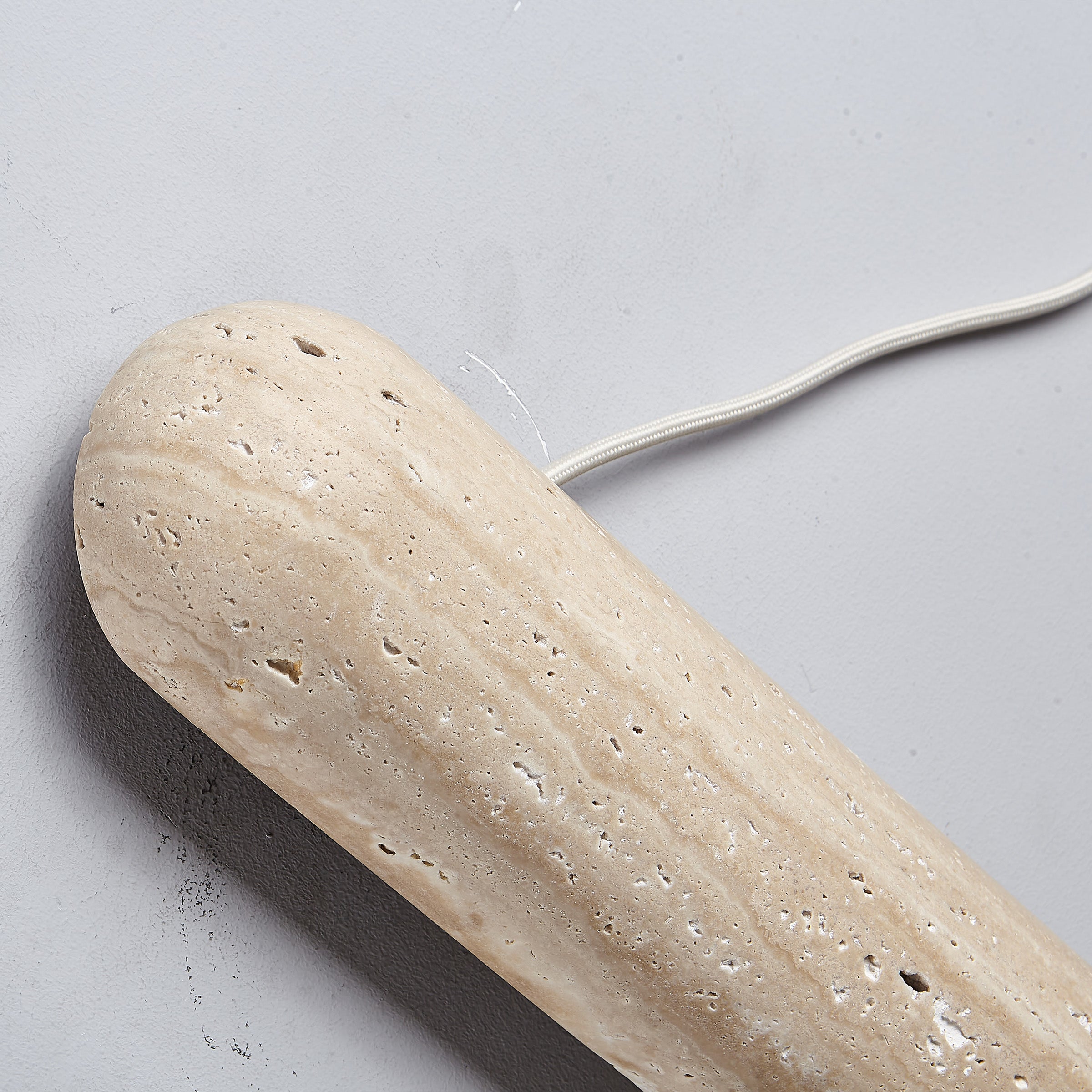 Beige natural travertine marble wall lamp by BEACON, featuring a sleek rectangular design for modern interior lighting.