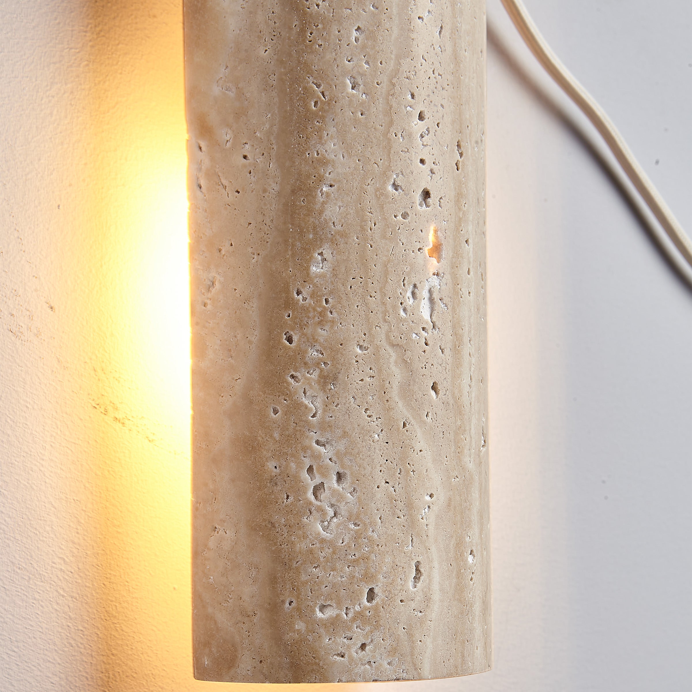 Beige natural travertine marble wall lamp by BEACON, featuring a sleek, modern design for stylish interior lighting.