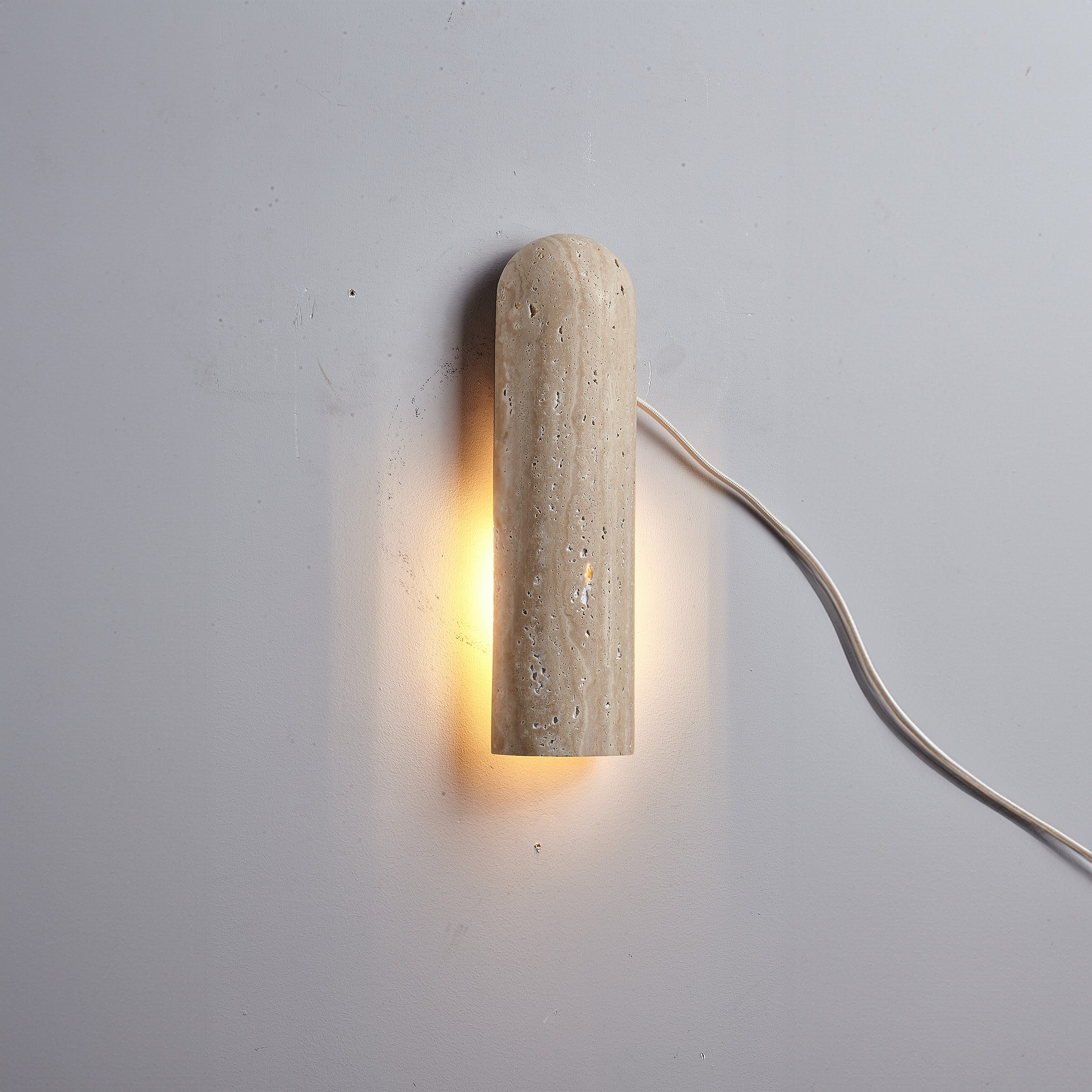 Beige natural travertine marble wall lamp by BEACON (JIADG), featuring a sleek rectangular design and warm lighting.