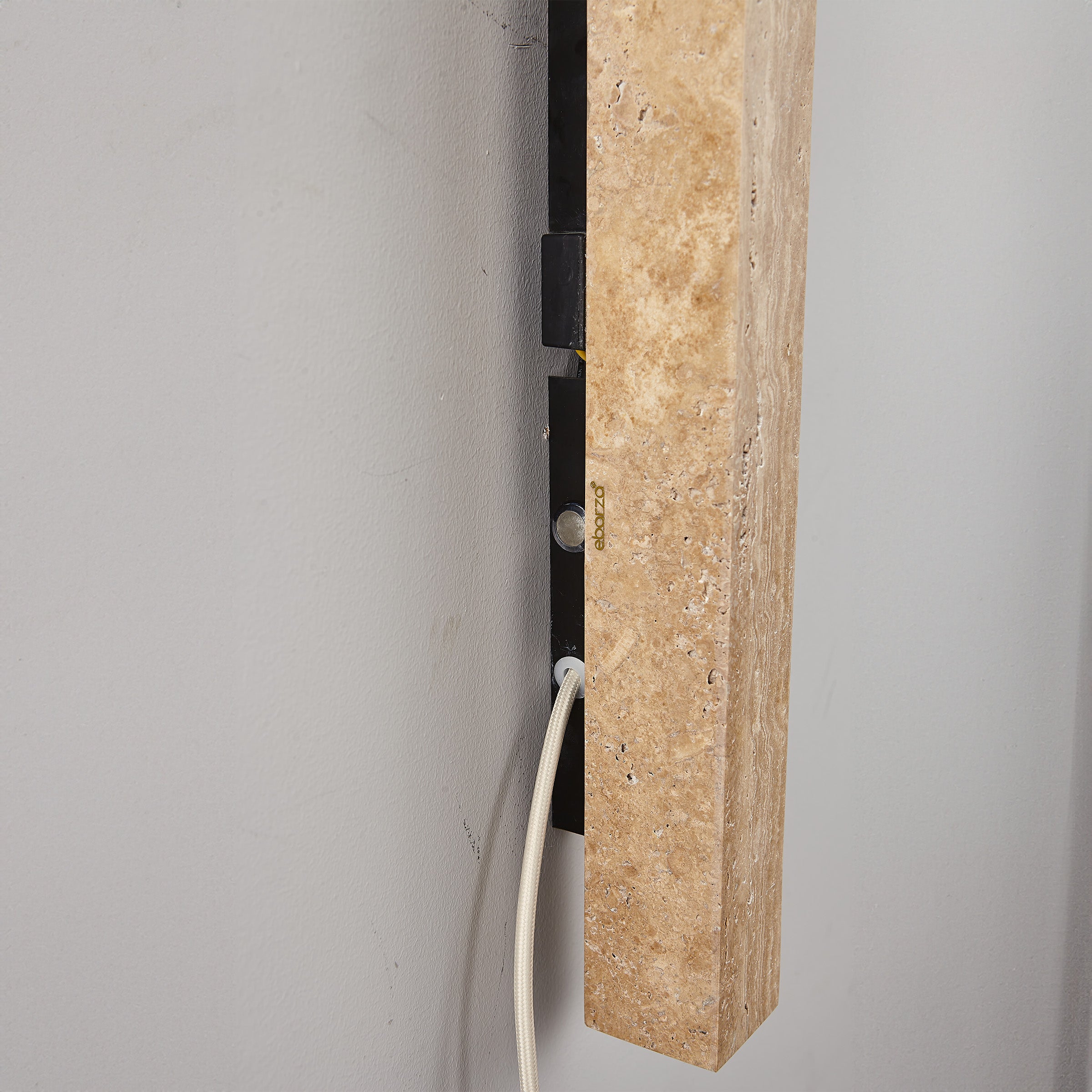 Beige natural travertine marble wall lamp by BEACON (JIADG), featuring a sleek, modern design with a warm glow.