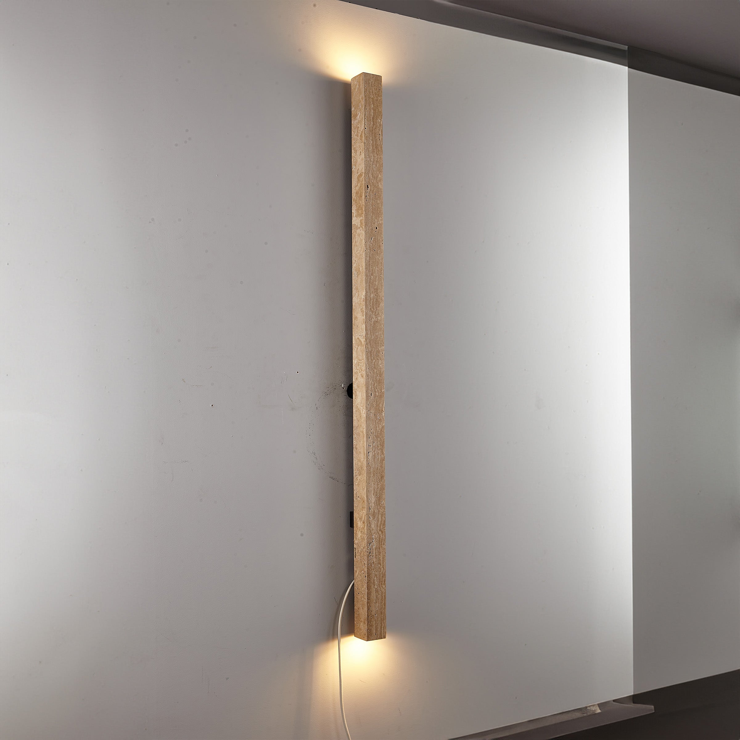 Beige natural travertine marble wall lamp by BEACON, featuring a sleek rectangular design and modern wall-mounted lighting.