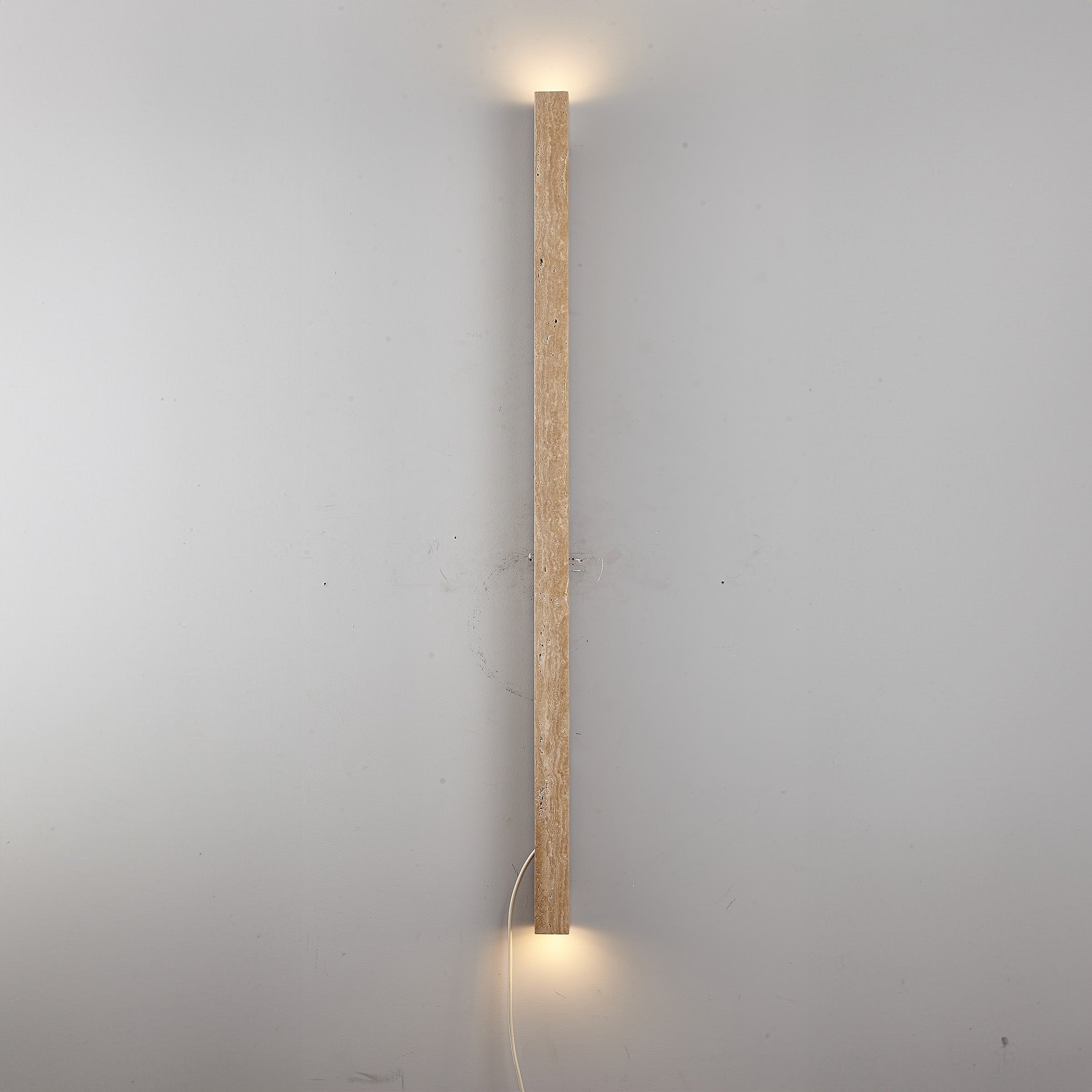 Beige natural travertine marble wall lamp by BEACON, showcasing a stylish wall-mounted light fixture with a smooth marble finish.
