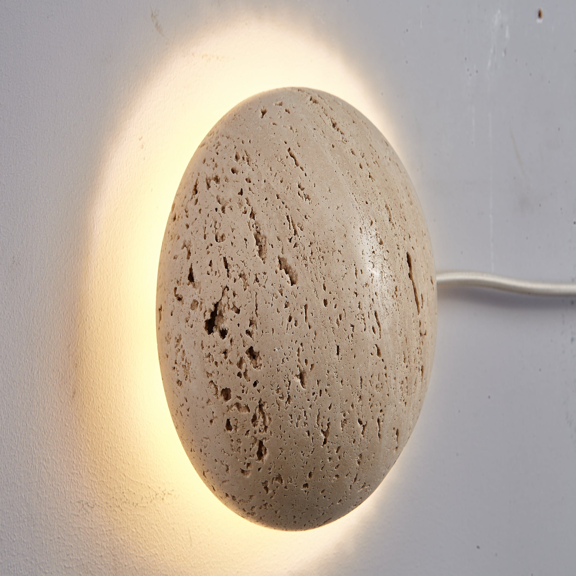 Beige natural Travertine marble wall lamp by BEACON, modern wall-mounted lighting fixture with elegant stone finish.