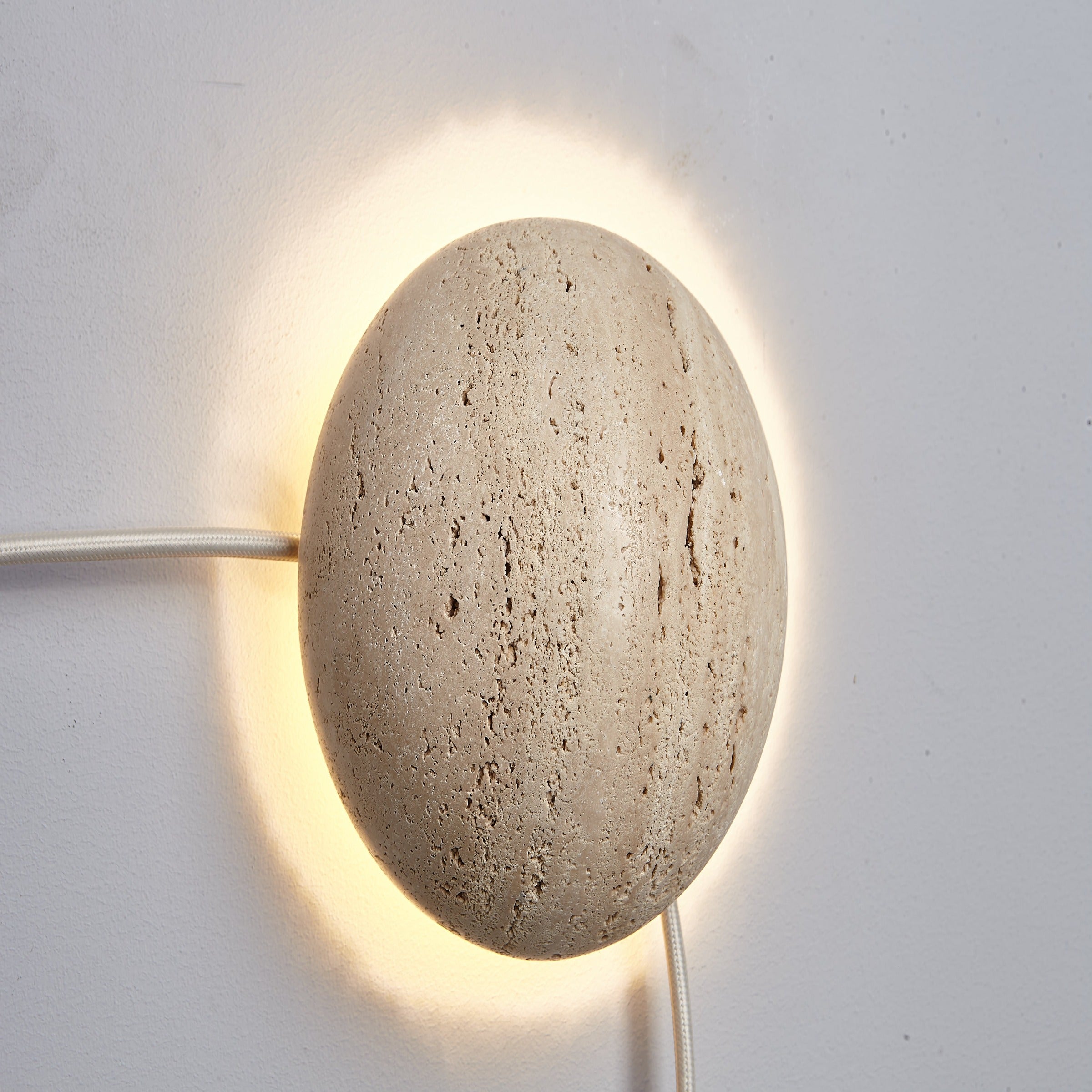 Beige natural Travertine marble wall lamp by BEACON, stylish wall-mounted lighting fixture with elegant stone finish.