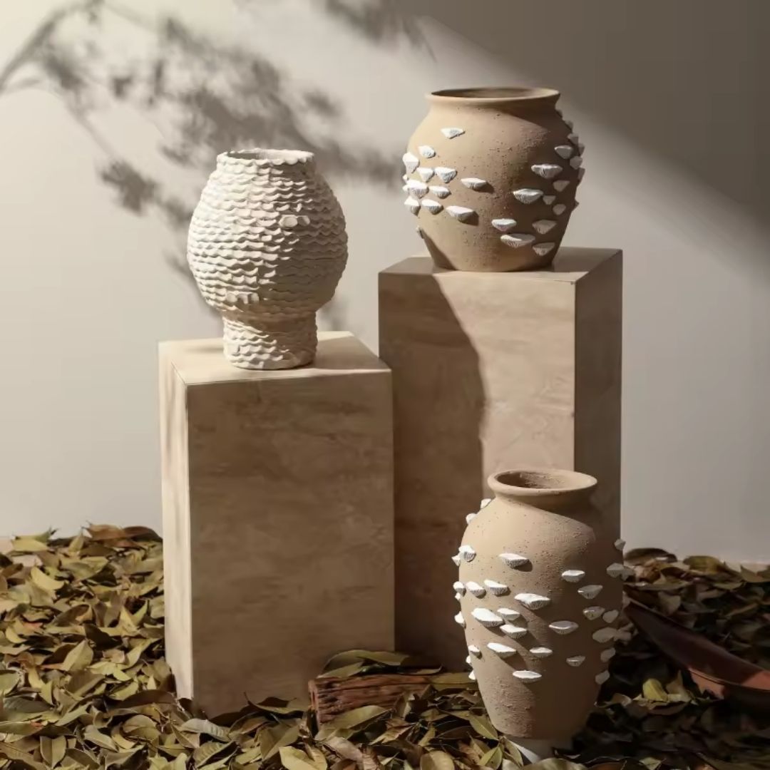 Beige and white cement vase with shell detail, decorative flower vase from BEACON, perfect for coastal-inspired decor.