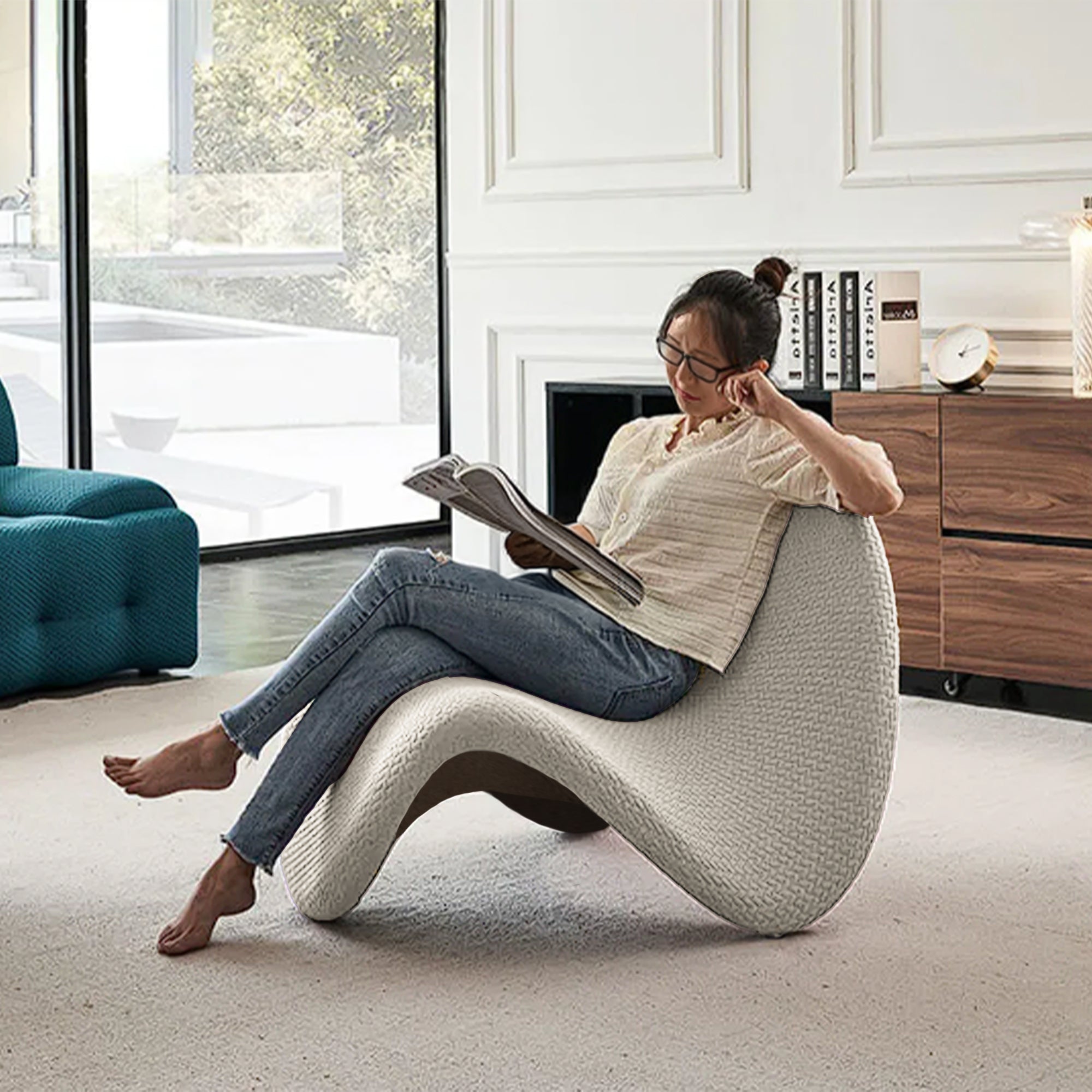 Beige Worm lounge chair by BEACON featuring a modern, curved design with plush beige upholstery for comfortable seating.