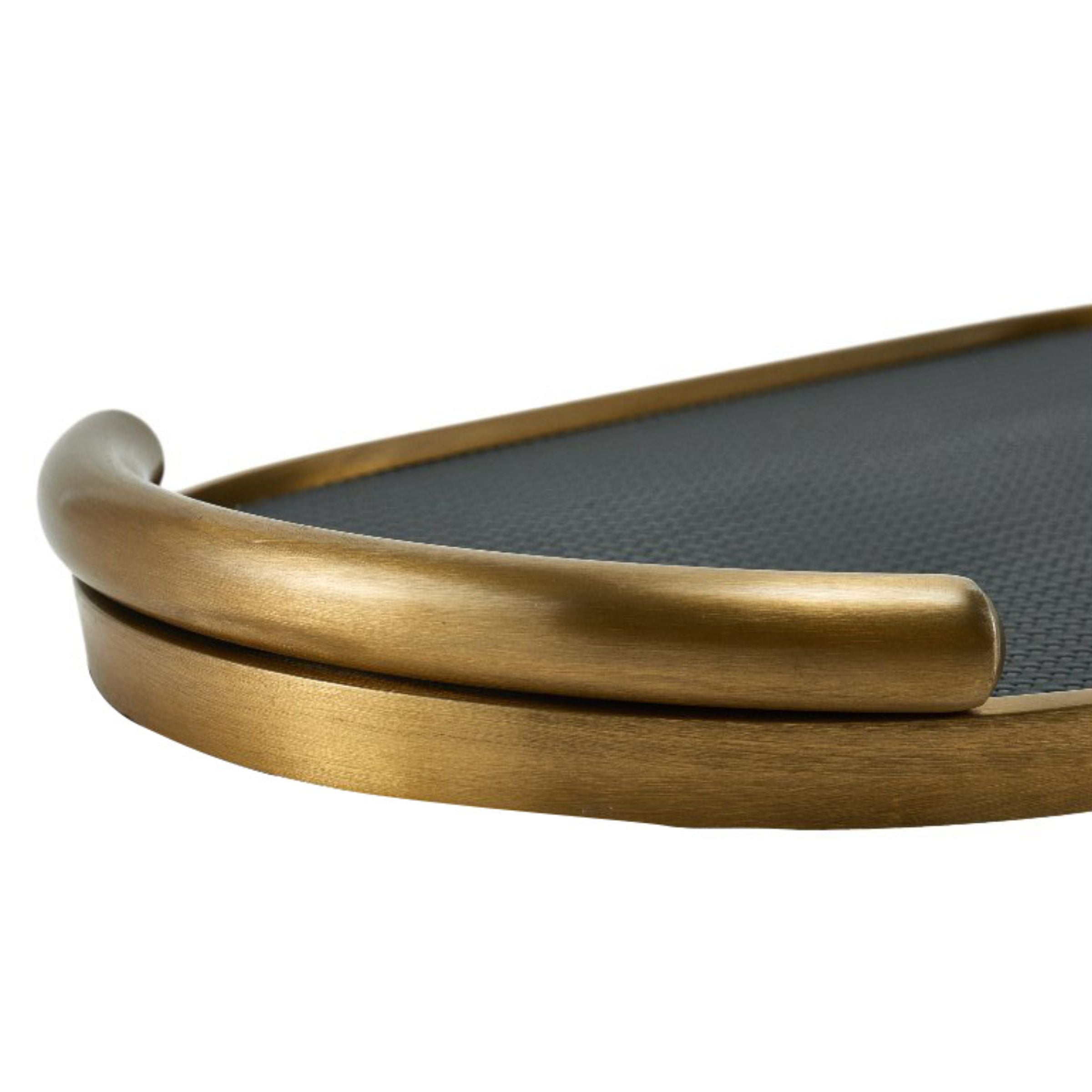 Black and brushed gold oval leather tray by Beacon, stylish accessory for organizing or displaying items.