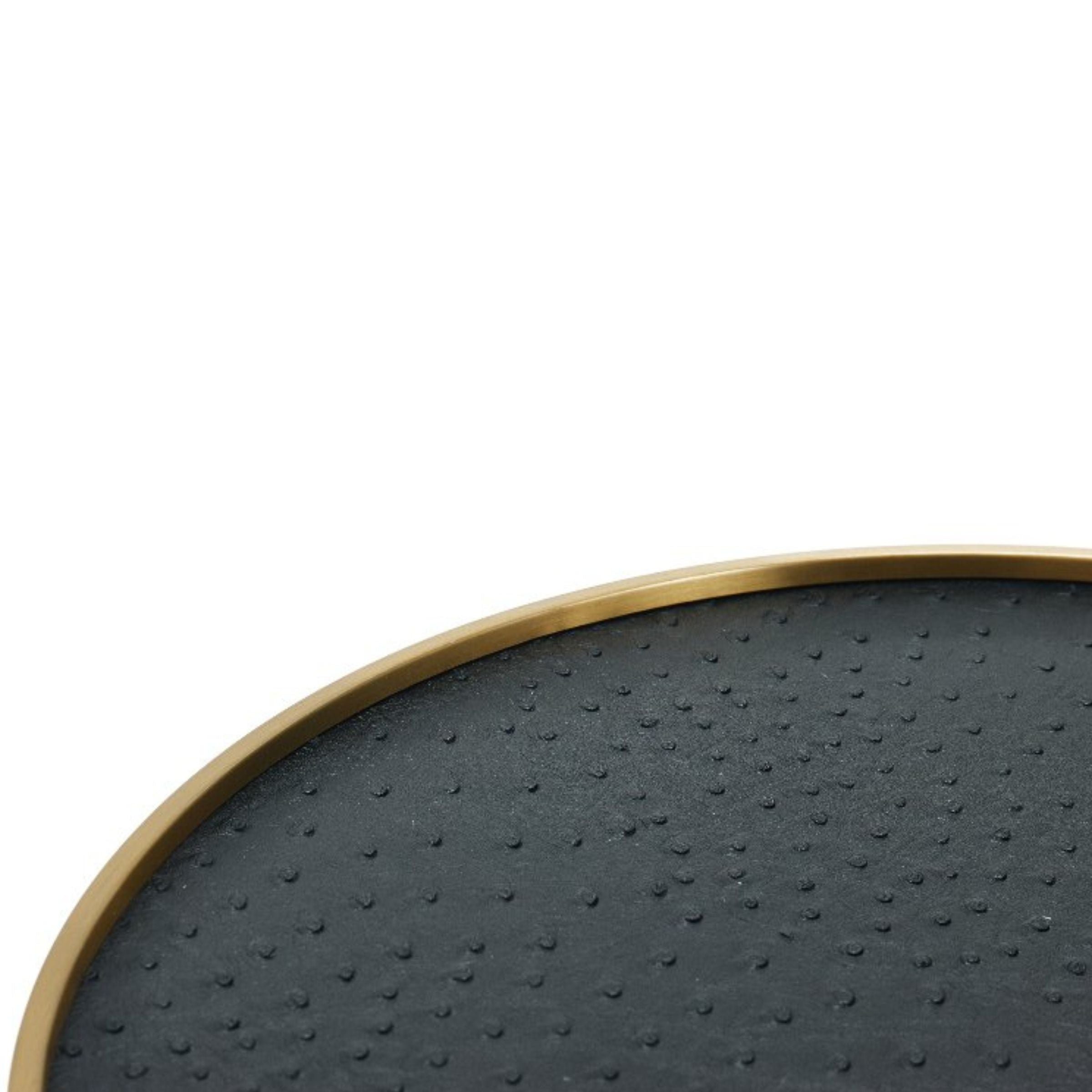 Black and brushed gold round decorative tray by BEACON, perfect for stylish home organization or serving.
