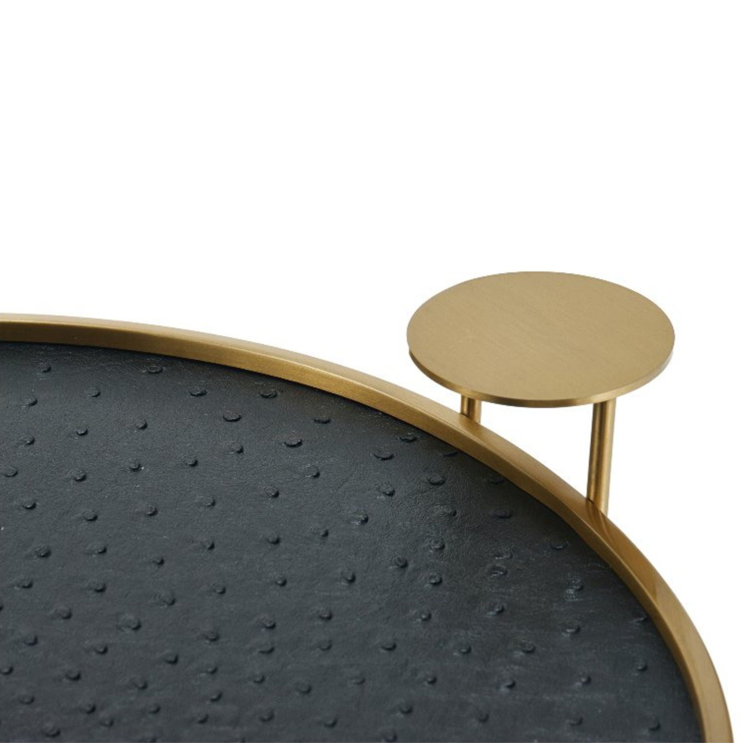 Black and brushed gold round decorative tray by Beacon, ideal for stylish display or serving purposes.