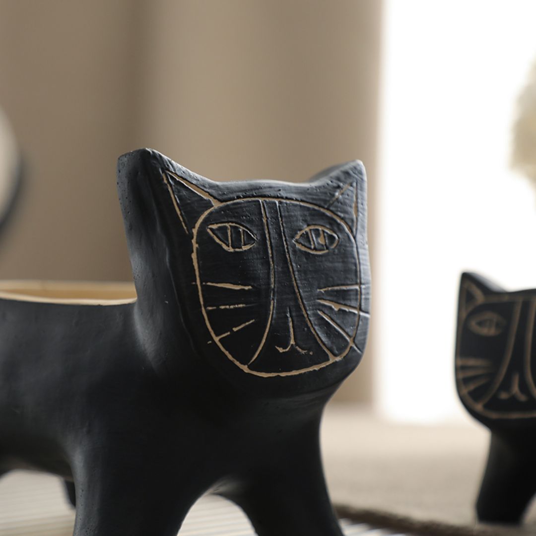 Black cat home decor figurine by BEACON, detailed black feline sculpture for stylish interior decoration.