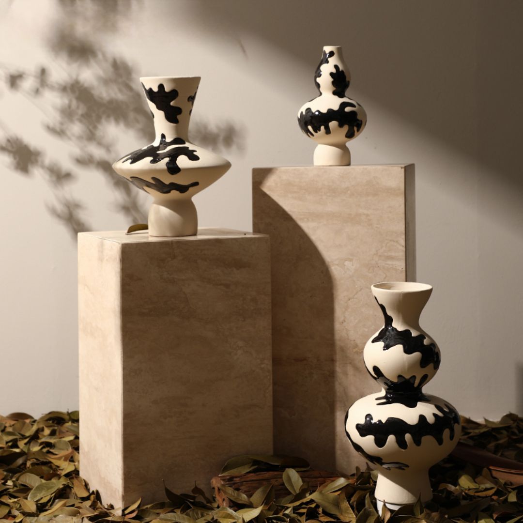 Black hand-painted ceramic vase from BEACON, featuring artistic brushwork, ideal for decorative or floral display.