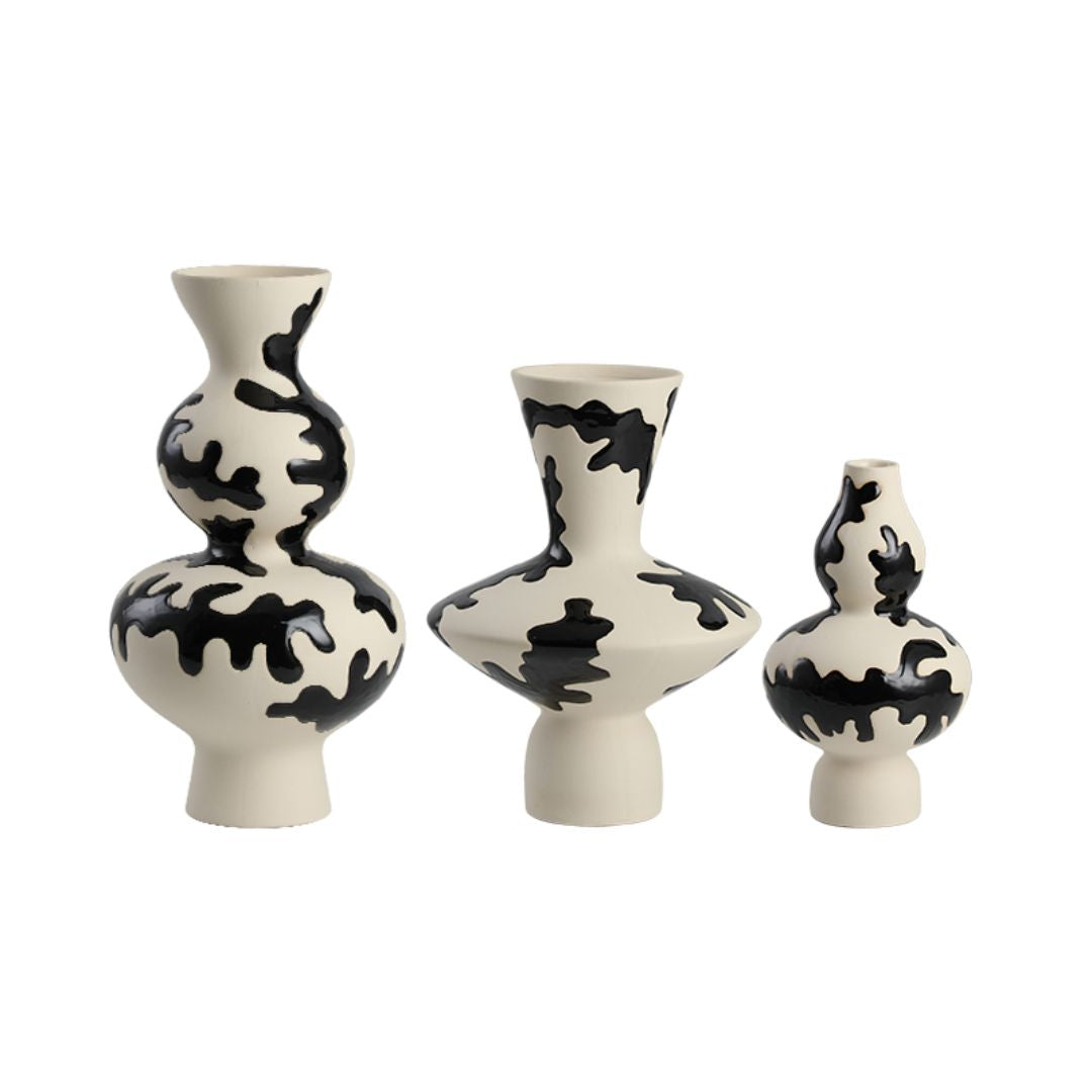 Black hand-painted vase from BEACON, featuring intricate design and a sleek black finish, ideal for decorative display.