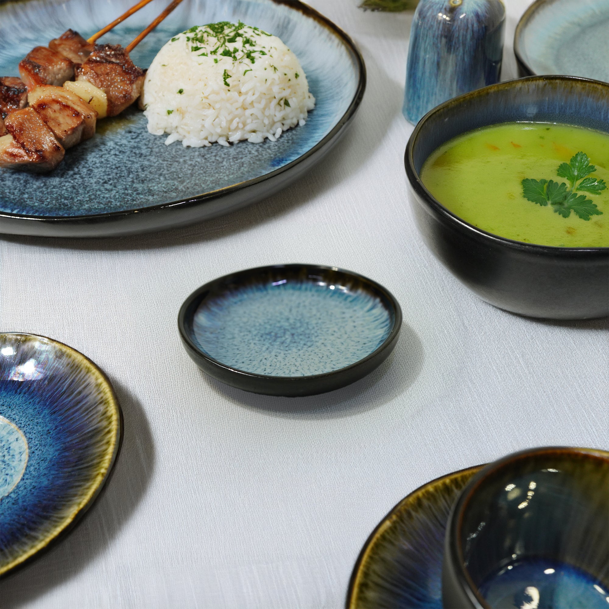 Blue Wave black and blue ceramic plate from BEACON, featuring a stylish wave design and smooth finish.