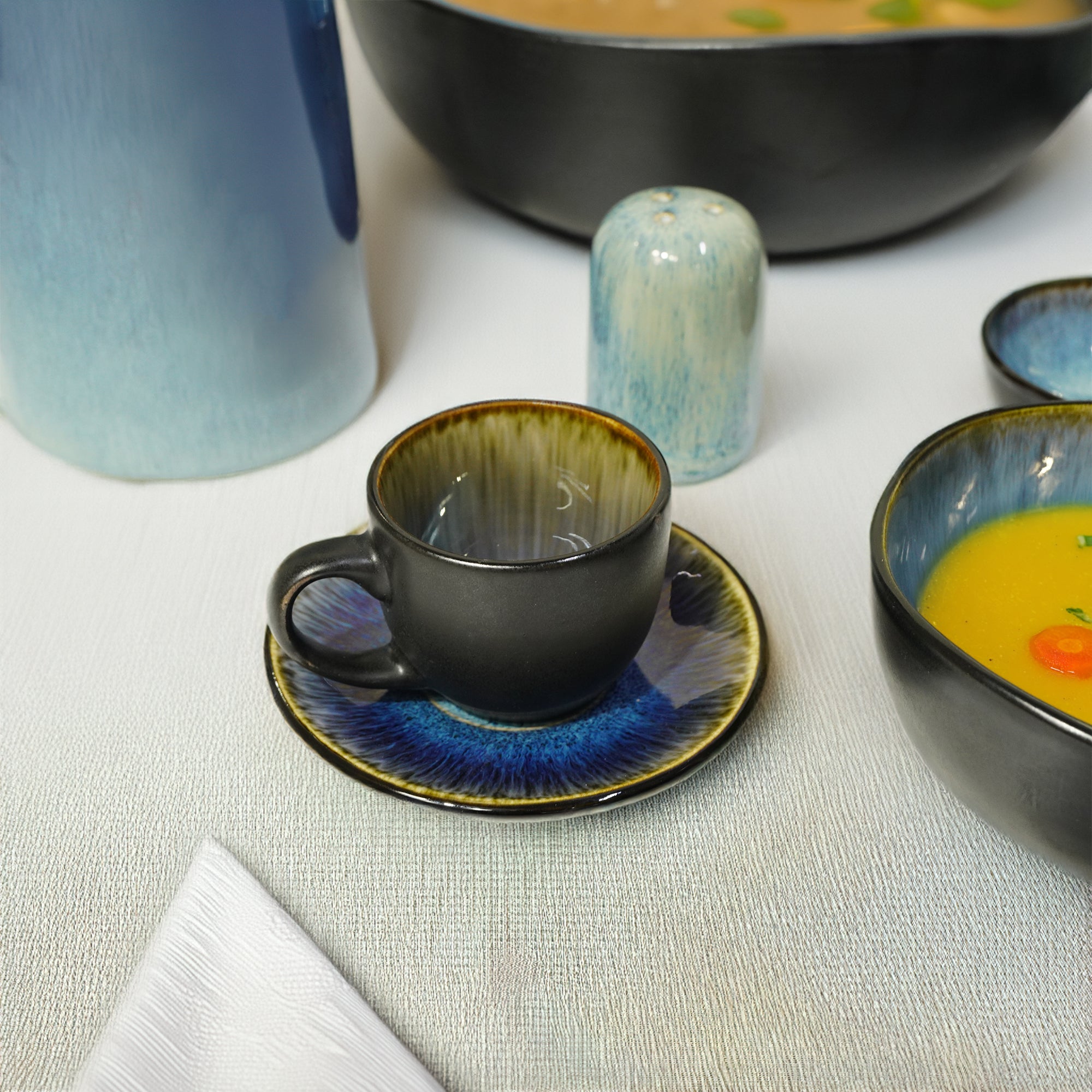 Blue Wave cups and saucer set by Beacon featuring black and blue wave design, perfect for elegant tea or coffee serving.