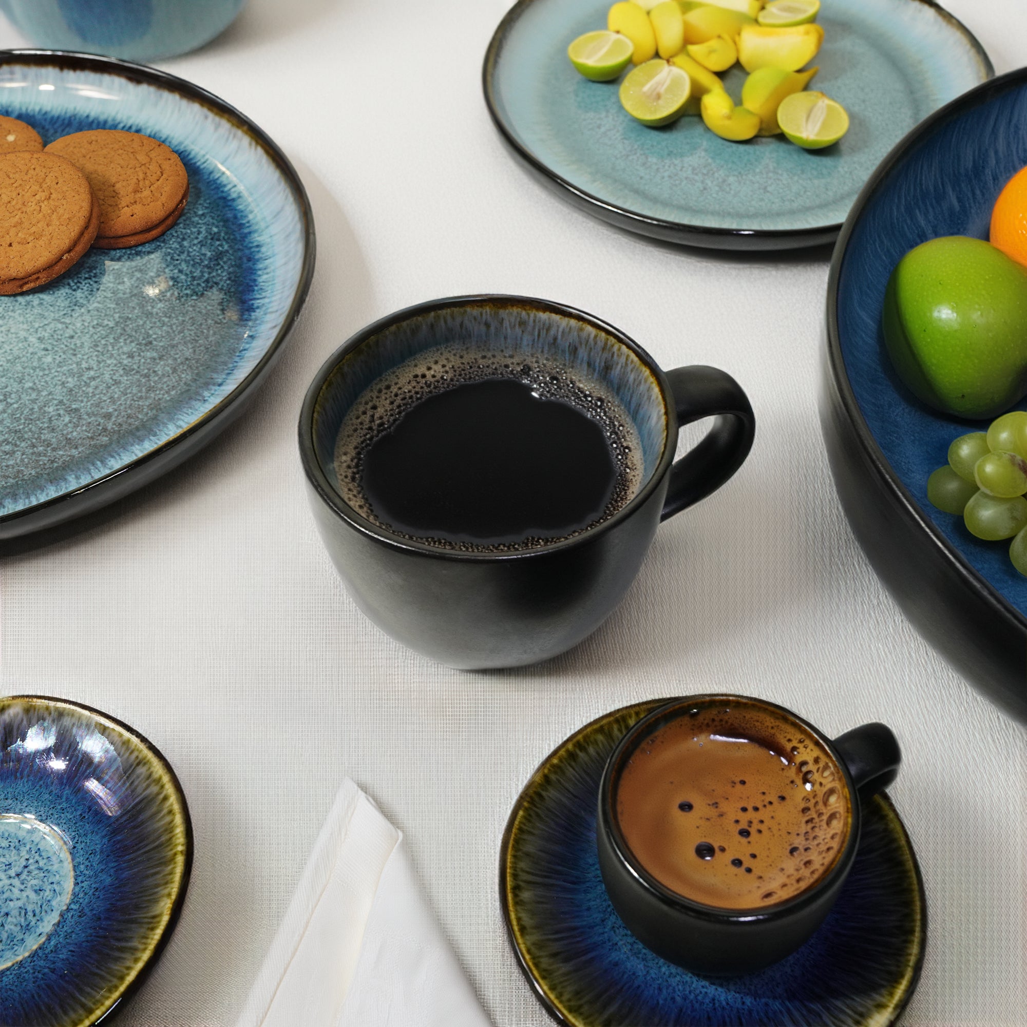 Blue wave mug by BEACON featuring black and blue colors, ceramic handle, and wave design for hot beverages.