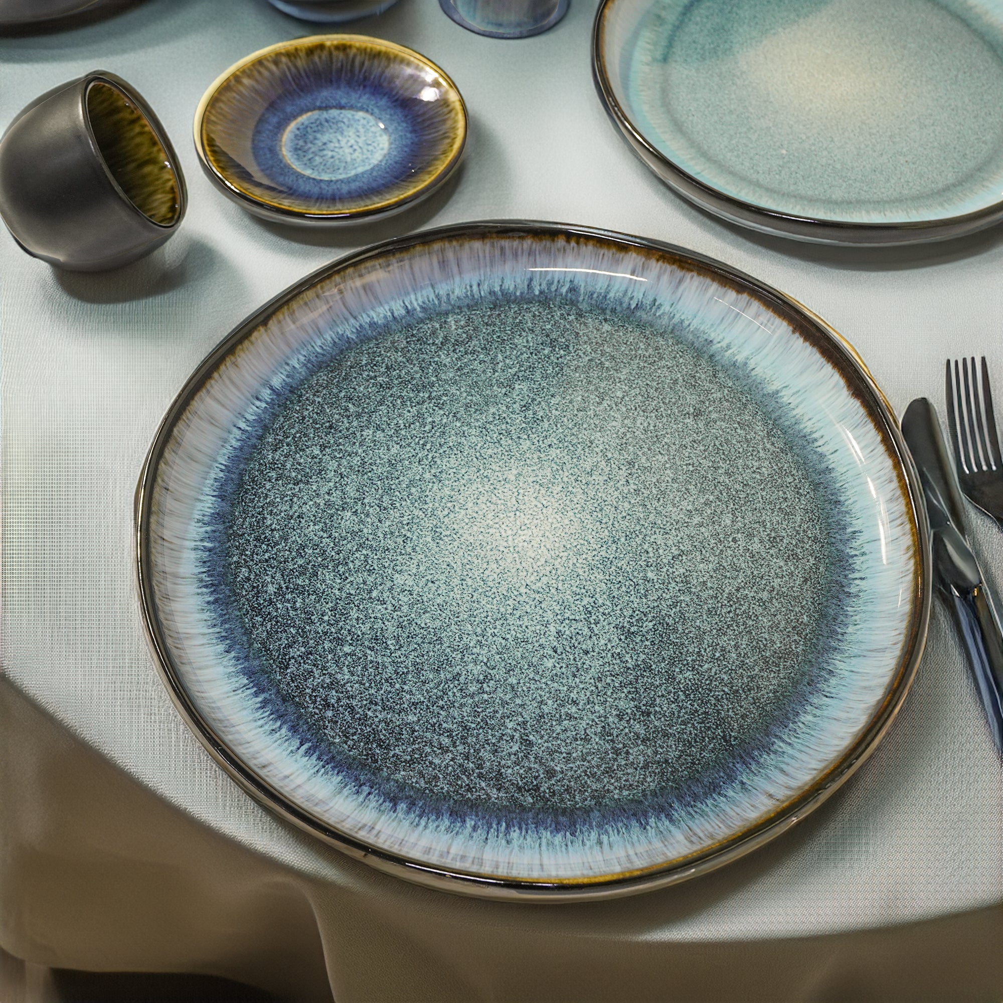 Blue Wave Salad Plate by Beacon featuring a black and blue wave design, perfect for stylish dining and salad presentation.