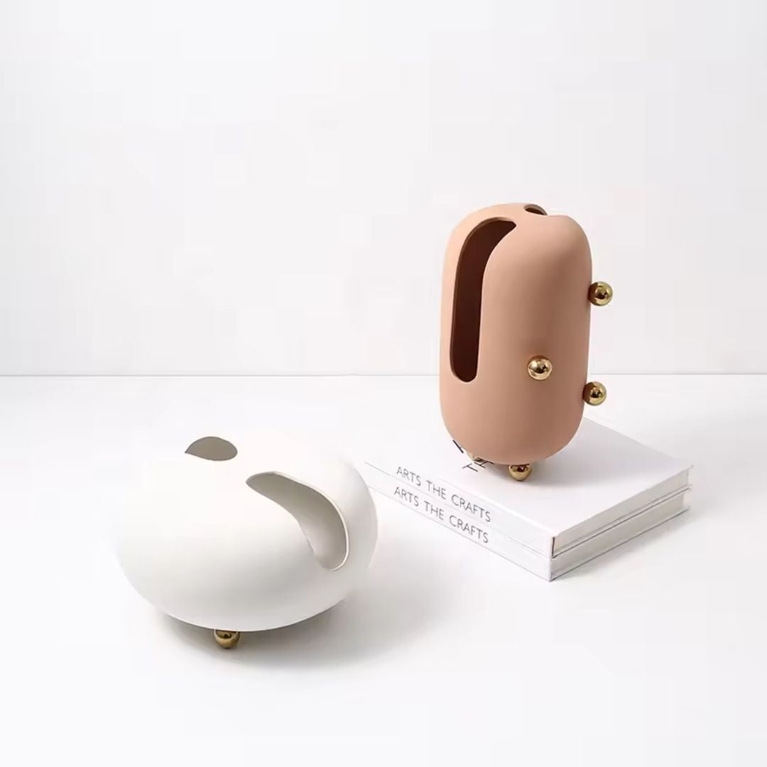 Small blush ceramic vase with gold stainless steel detail by BEACON, perfect for elegant floral displays.