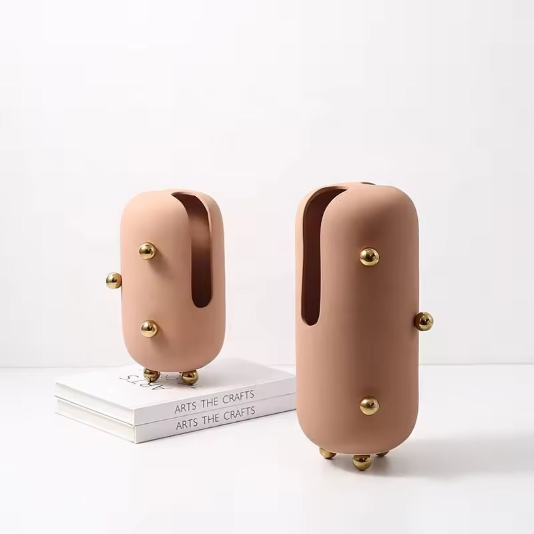 Small blush ceramic vase with gold stainless steel detail, designed by BEACON, perfect for elegant home décor.