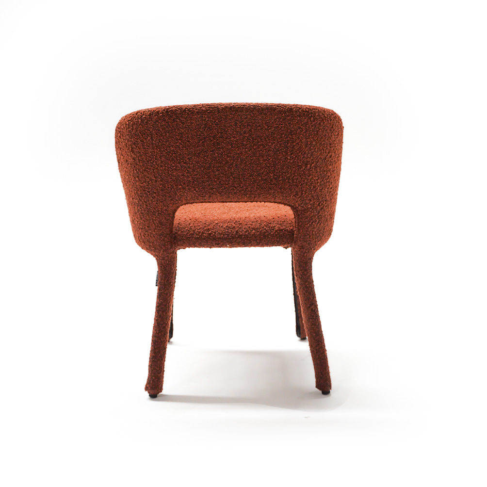 Brown dining chair with steel frame from BEACON, featuring a sleek design and comfortable seating.