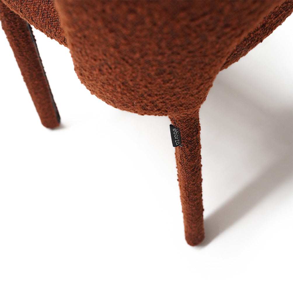 Brown dining chair with a steel frame, featuring a comfortable cushioned seat and sleek design from BEACON.