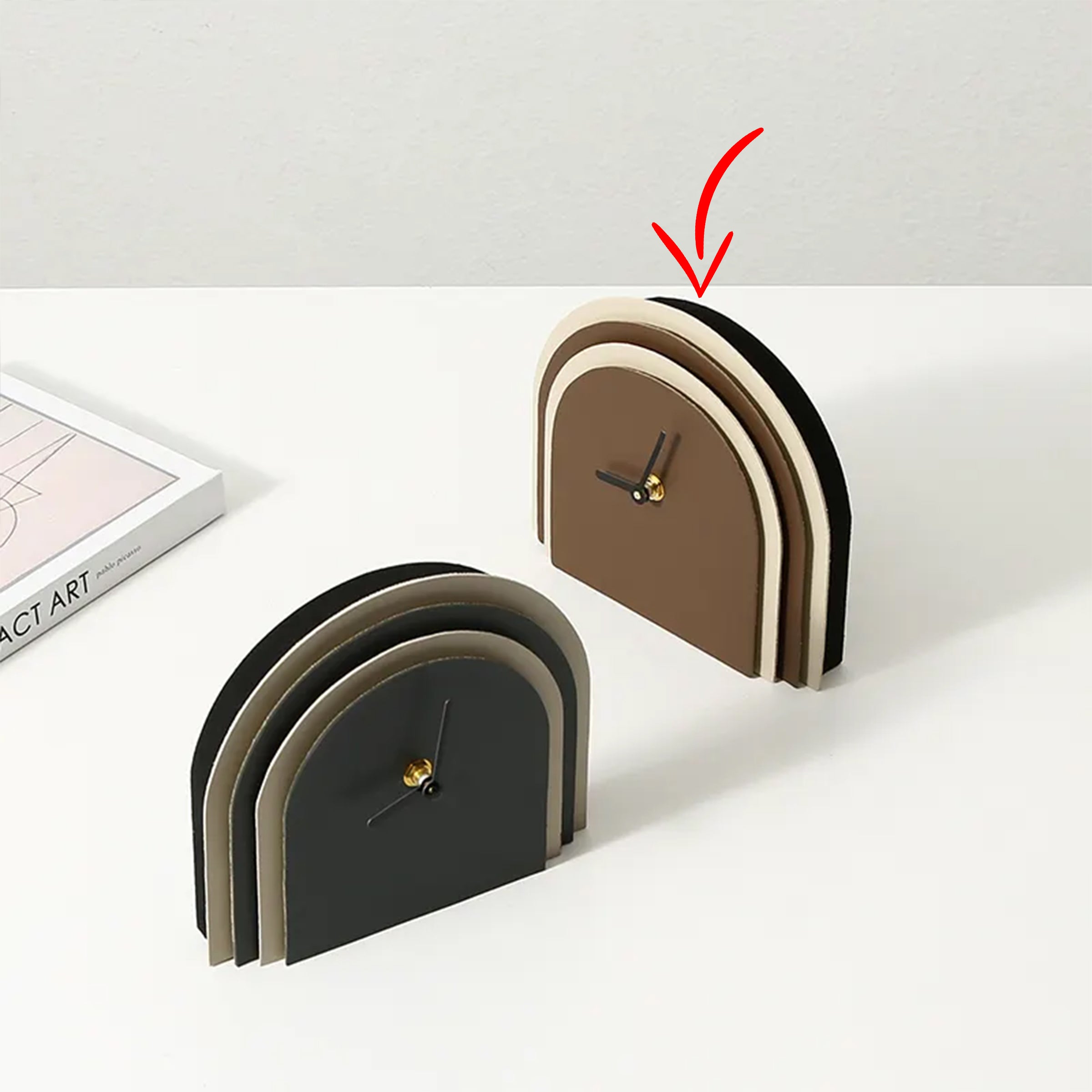 Brown Leather Clock by BEACON with a sleek round face and leather strap, modern and stylish home decor accessory.