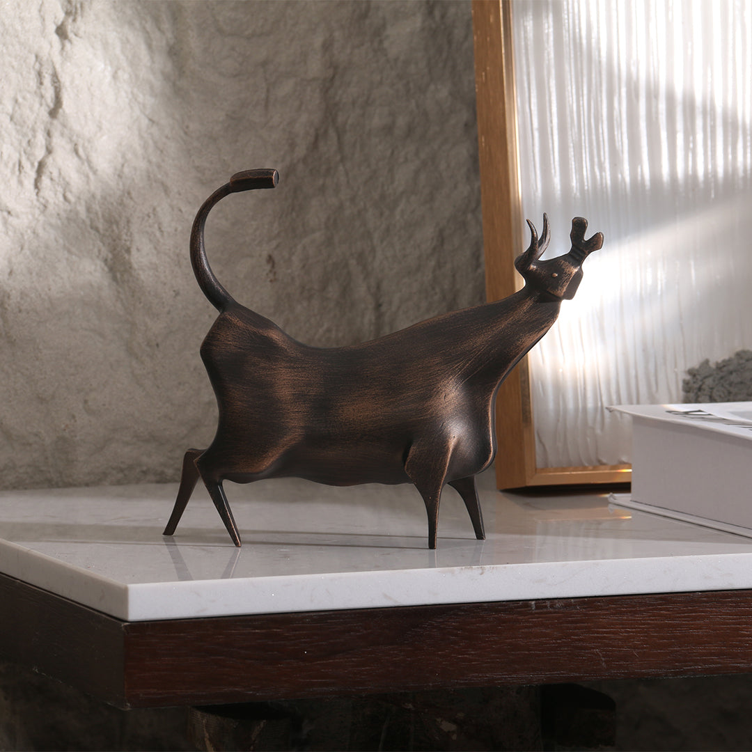 Beige bull sculpture from BEACON home decor figurines collection, detailed and artistic decorative figurine.
