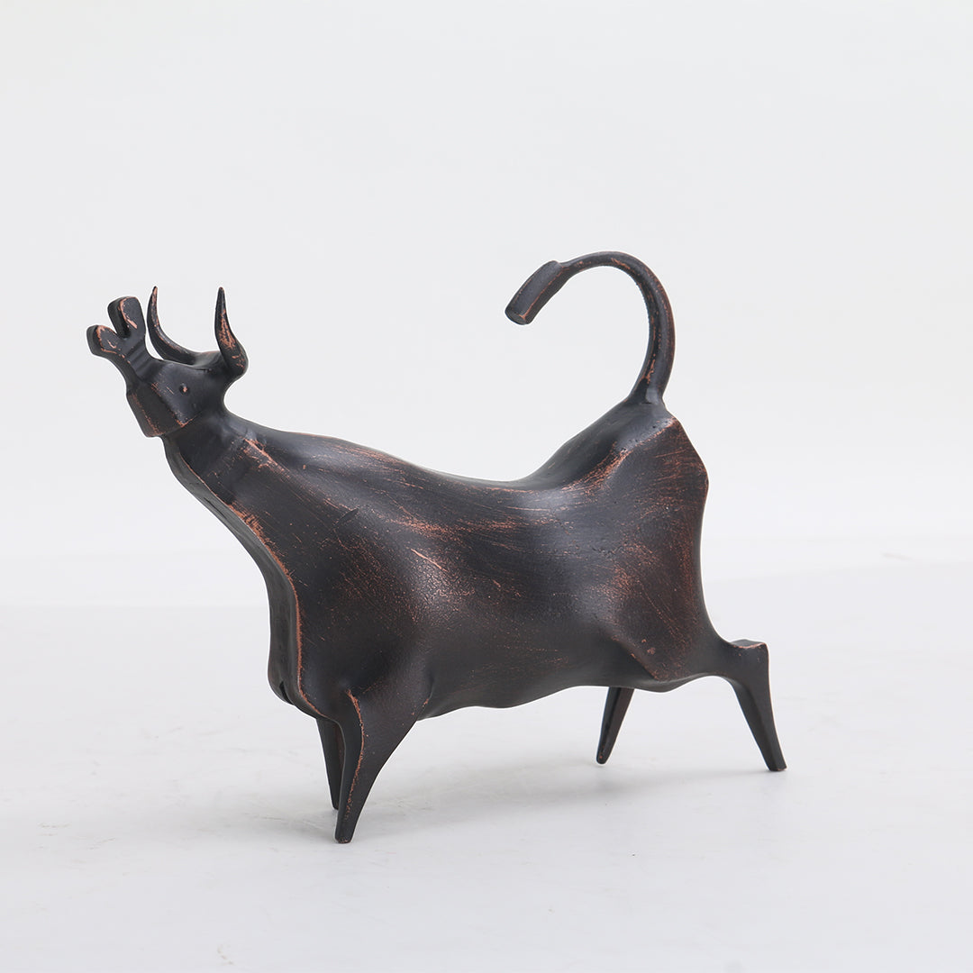 Beige bull sculpture from BEACON home decor figurines collection, detailed animal figurine for stylish interior decor.