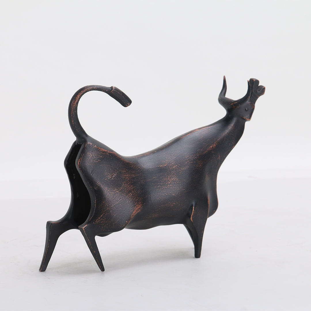 Beige bull sculpture by BEACON, a detailed home decor figurine with strong horns and muscular body, ideal for interior decoration.