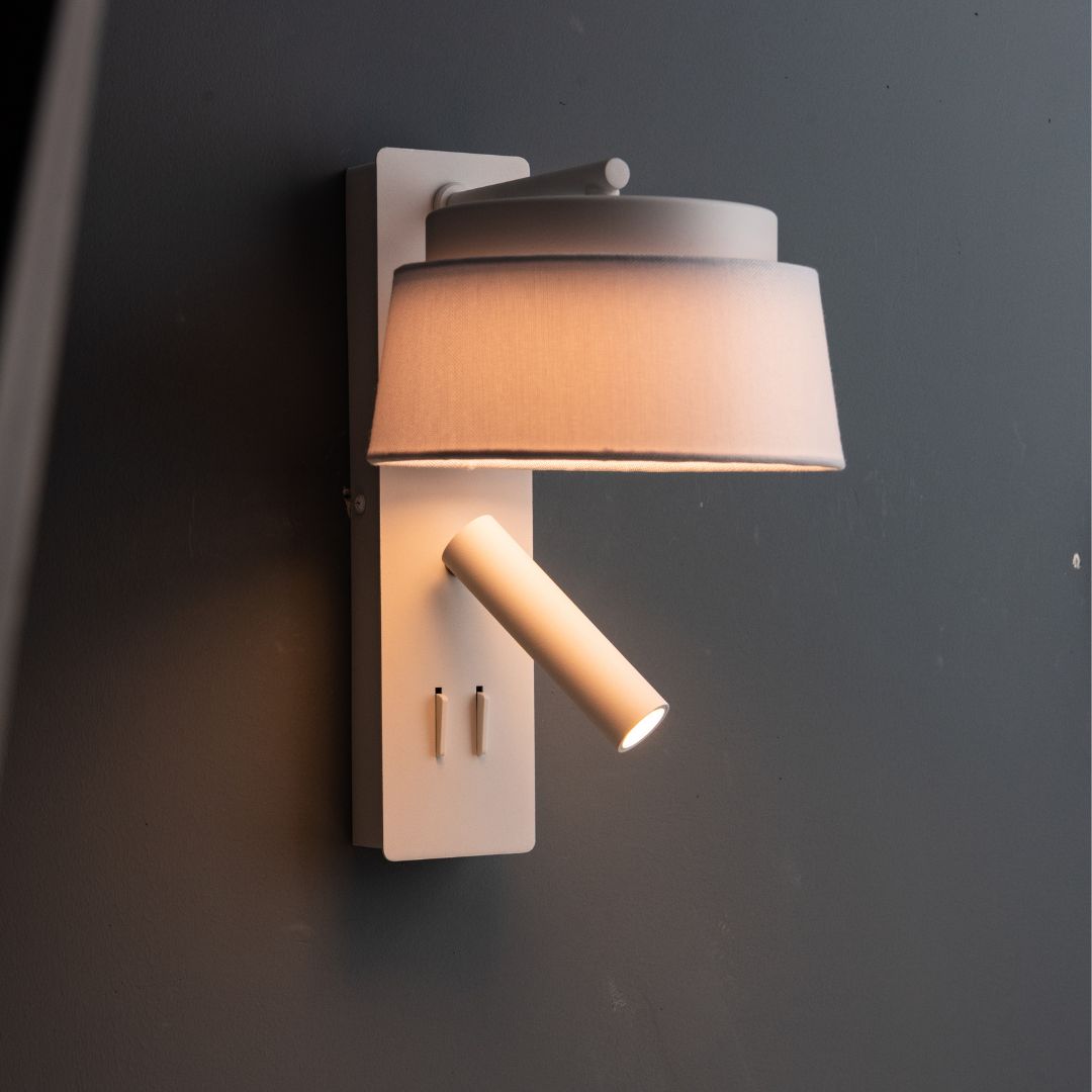 Calm hotel-style wall reading lamp with white and grey linen shade by BEACON, designed for headboards or wall mounting.