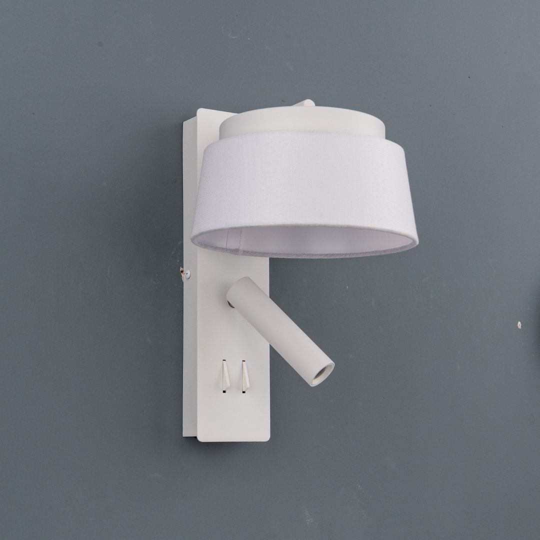 BEACON Calm hotel-style wall reading lamp with white and grey linen shade, mounted on a wall for cozy lighting.