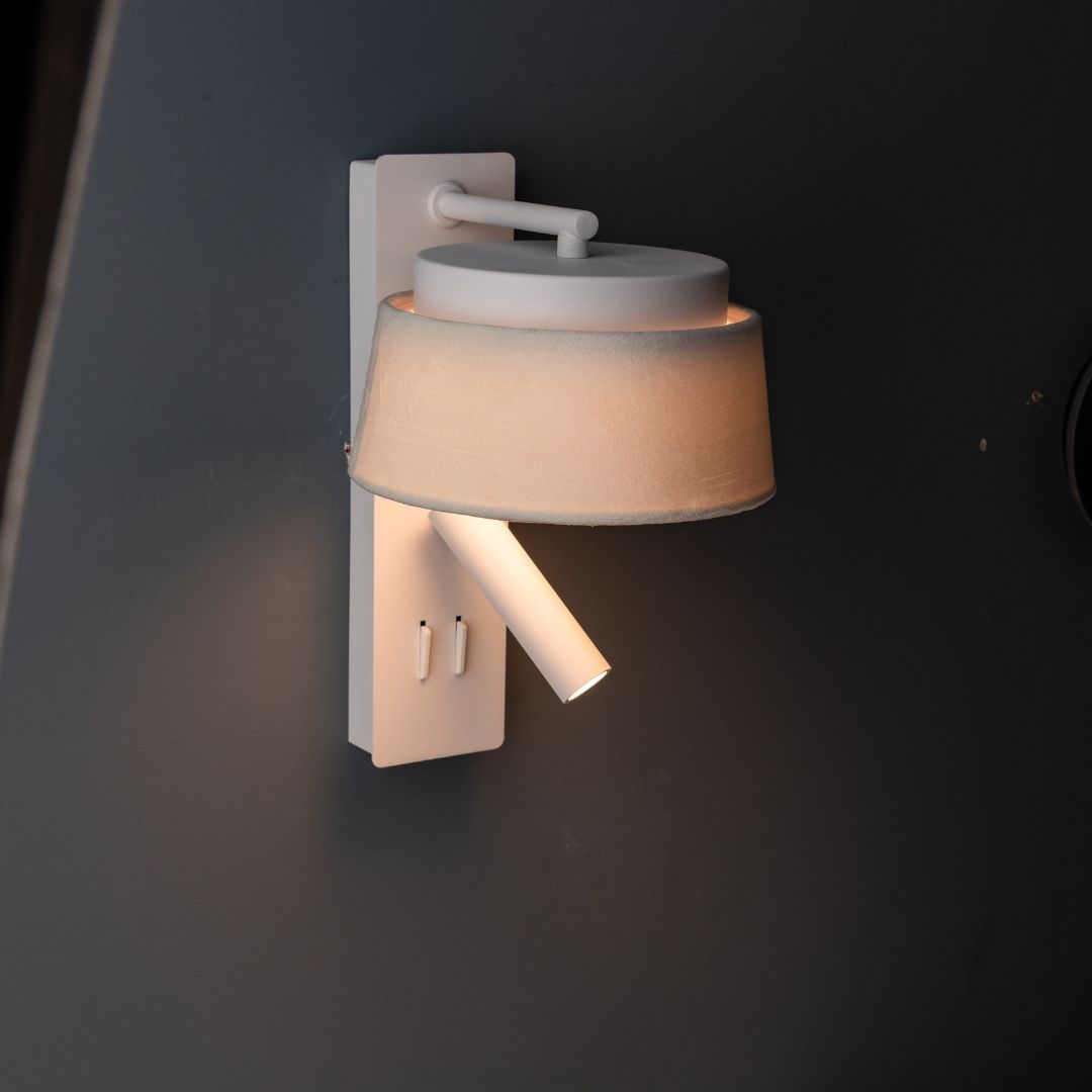 Wall-mounted hotel style reading lamp with white and grey linen shade, designed for headboards and wall decor by BEACON.
