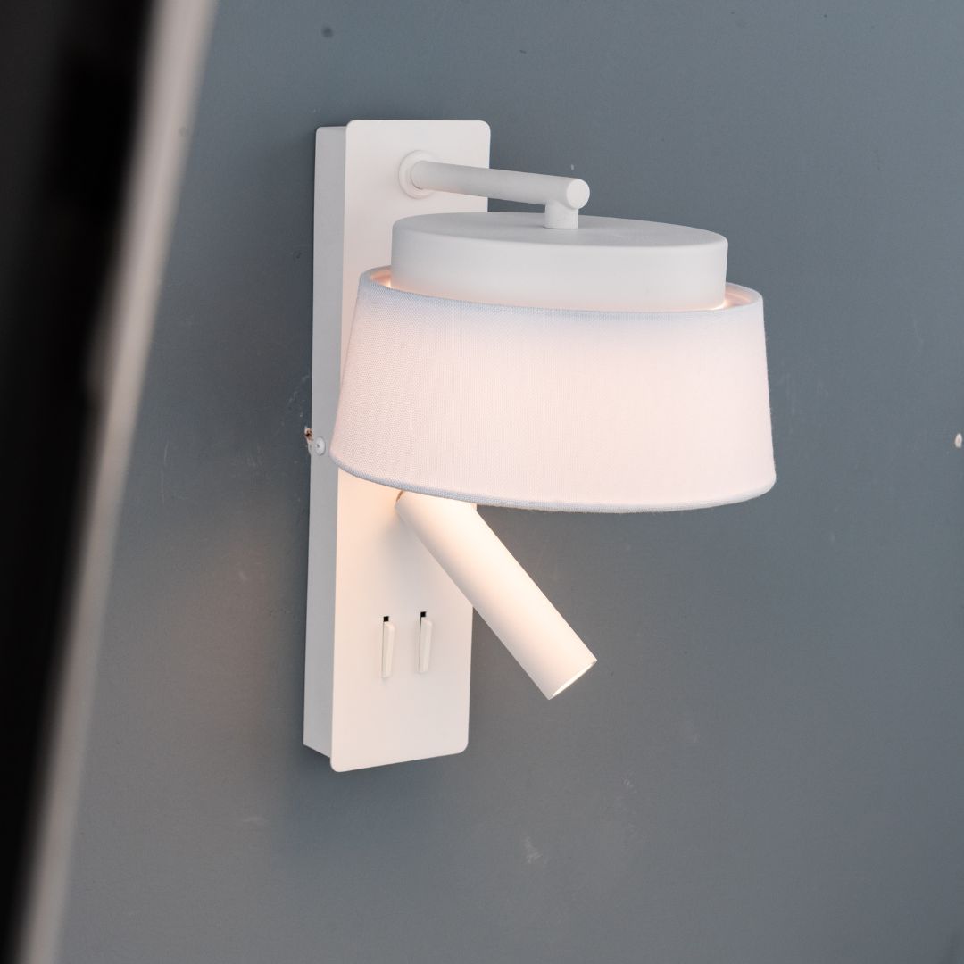 Calm hotel-style wall reading lamp with white and grey linen shade, designed for headboards or wall mounting by BEACON.