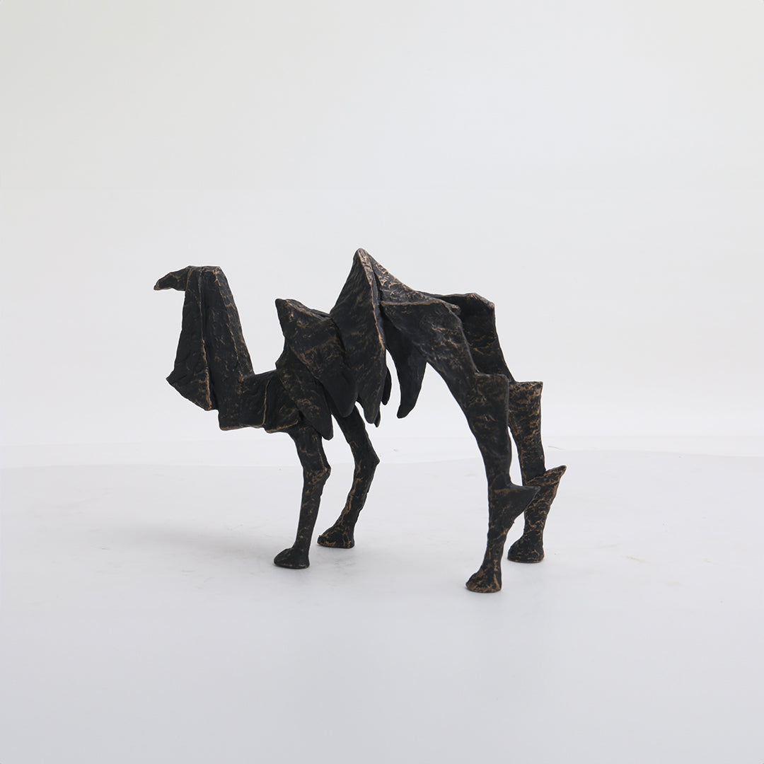 Beige ceramic camel sculpture from BEACON home decor figurines, detailed and stylish for interior decoration.