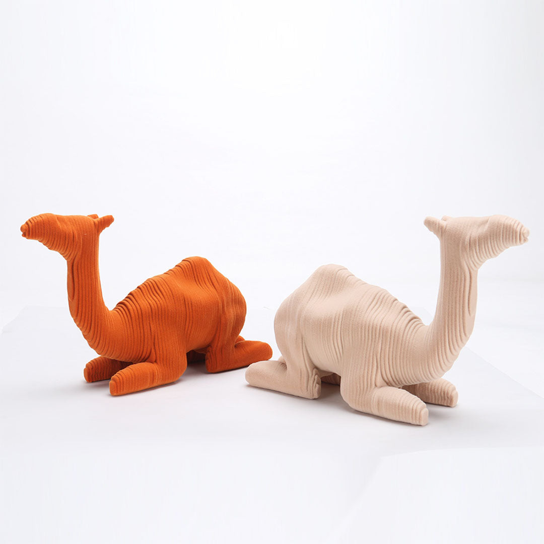 Orange ceramic camel sculpture from BEACON home decor figurines, detailed and stylish for modern interior decoration.