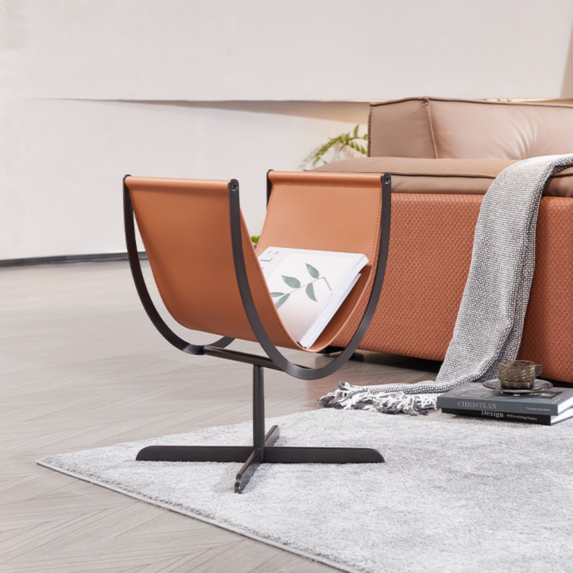 Caramel saddle leather and stainless steel side table by BEACON, modern accent table with sleek design and durable materials.