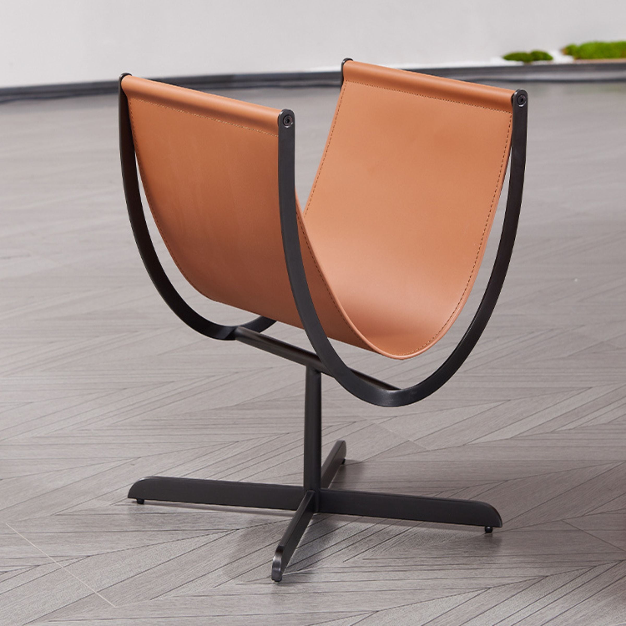 Caramel saddle leather and stainless steel side table by BEACON, modern design with sleek surfaces and sturdy legs.