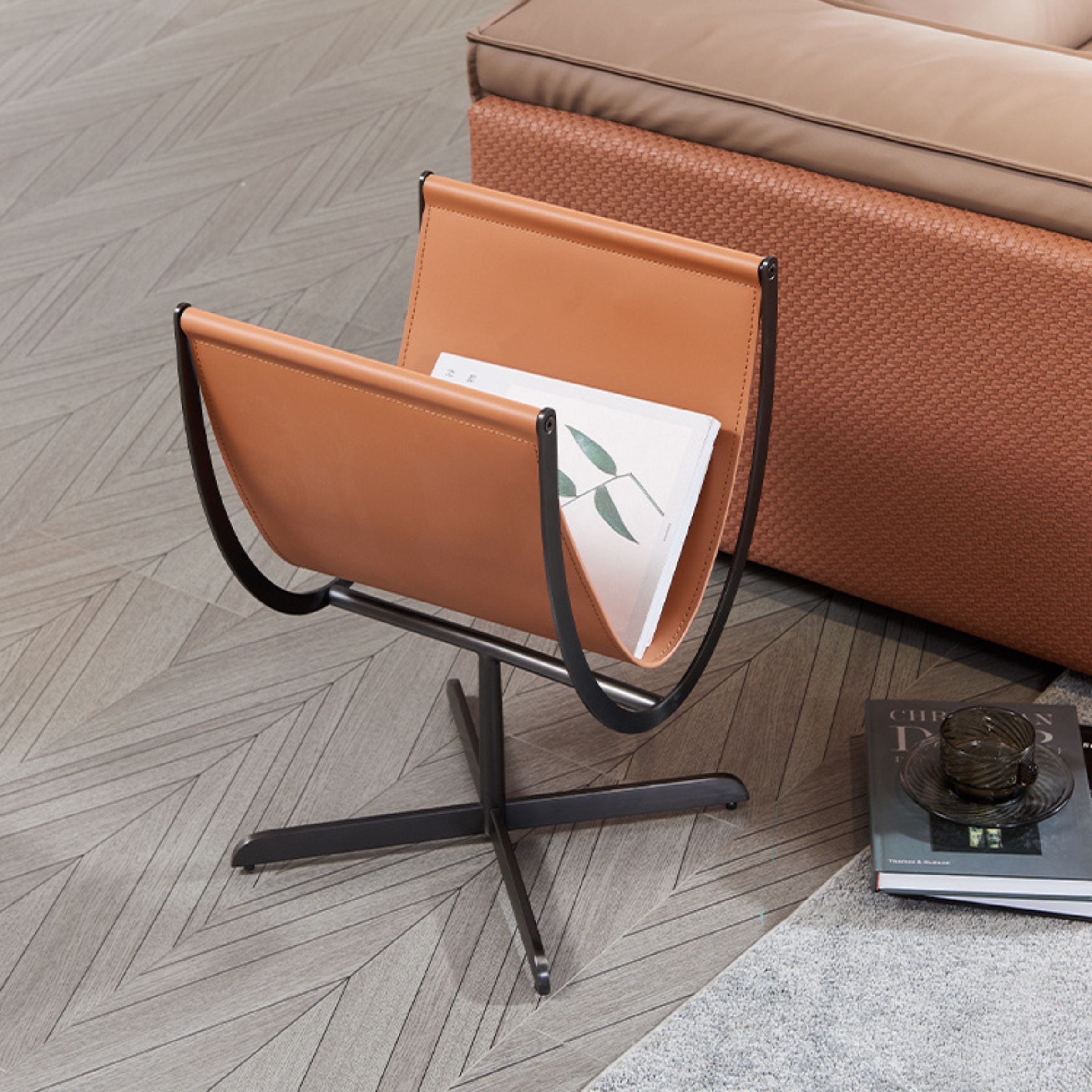 Caramel saddle leather and stainless steel side table by BEACON, modern design with sleek surface and sturdy construction.