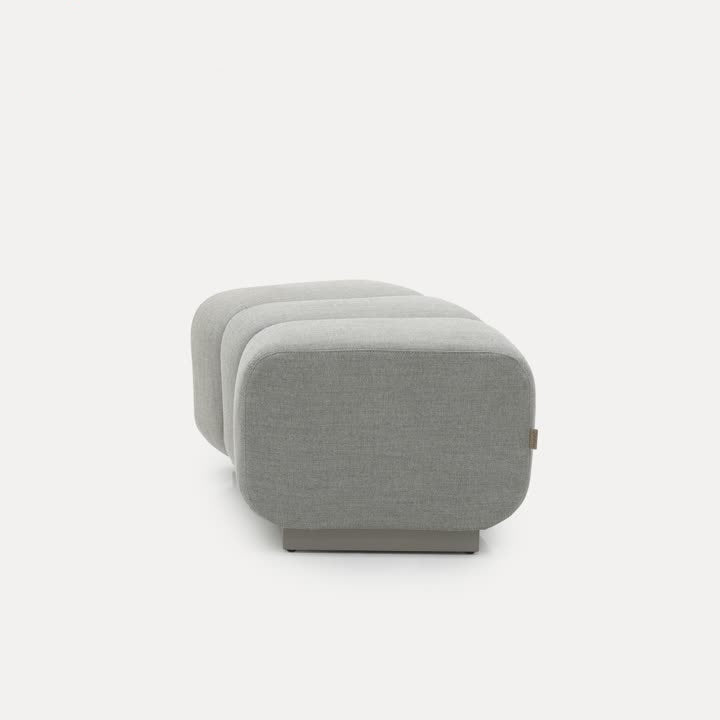 BEACON Chameleon Sofa Curved Pouf Ottoman with modern design, soft upholstery, and versatile shape for living room decor.