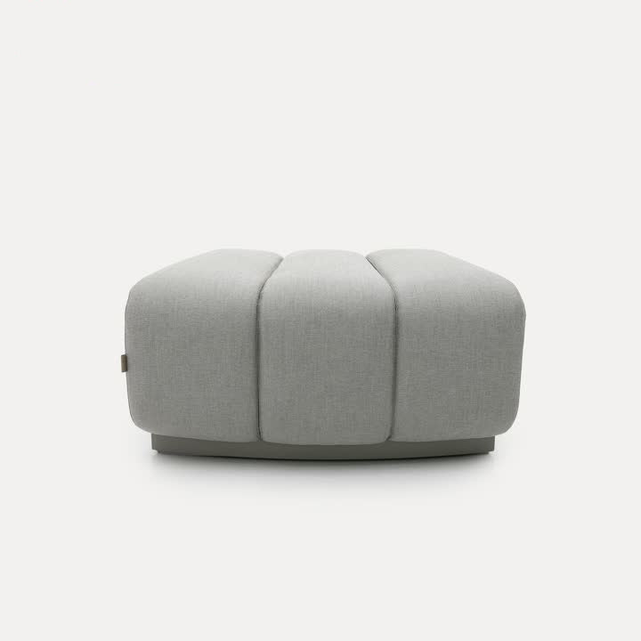 Chameleon Sofa Curved Pouf by BEACON, versatile ottoman with a curved design, soft upholstery, and modern style.