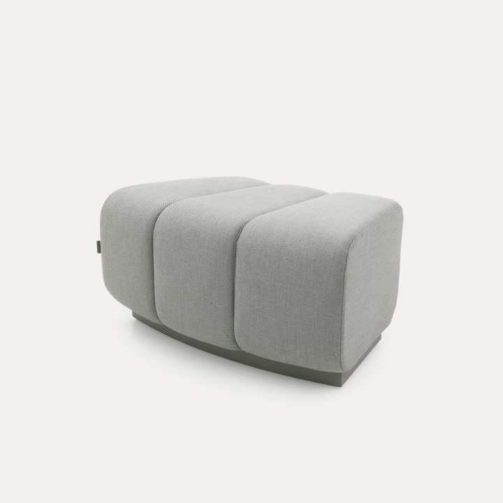 Chameleon Sofa Curved Pouf by BEACON, a stylish and modern ottoman with a curved design, perfect for contemporary living rooms.
