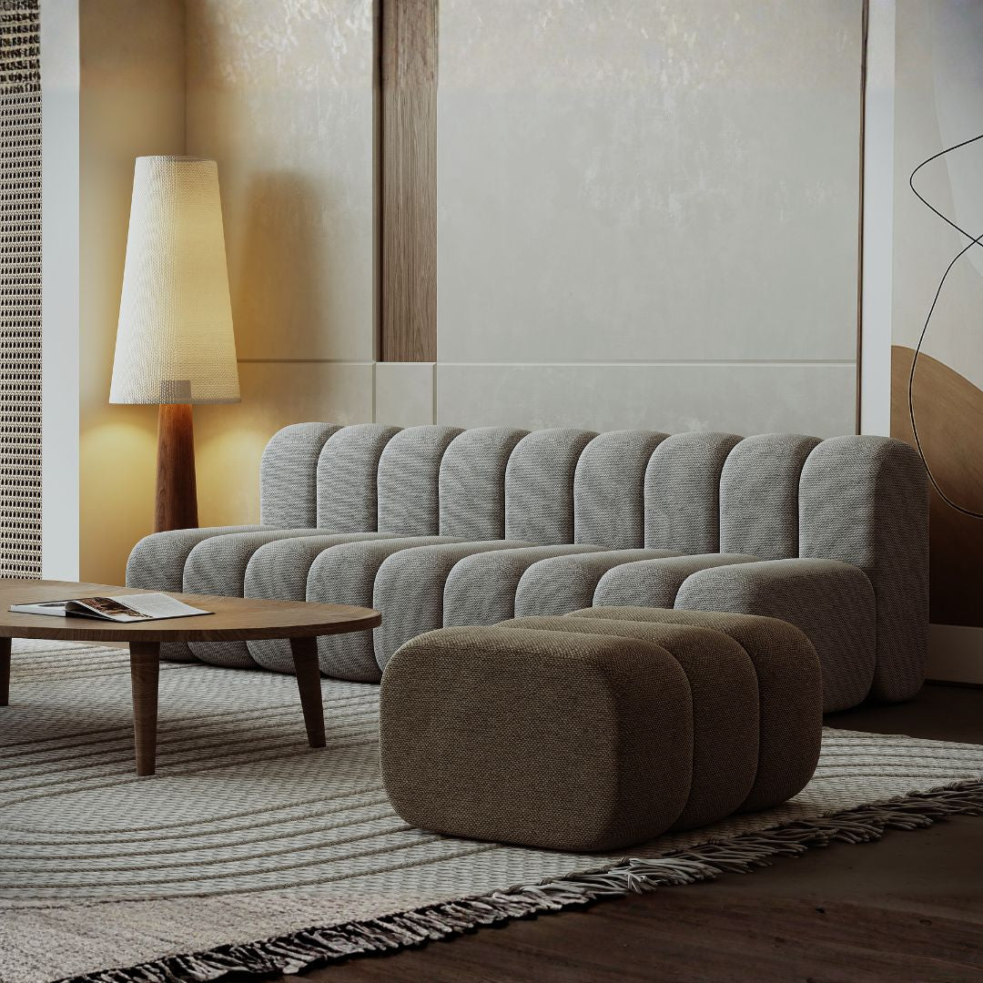 BEACON Chameleon Sofa Curved Pouf Ottoman, soft fabric upholstery with a sleek, modern curved design for versatile seating.