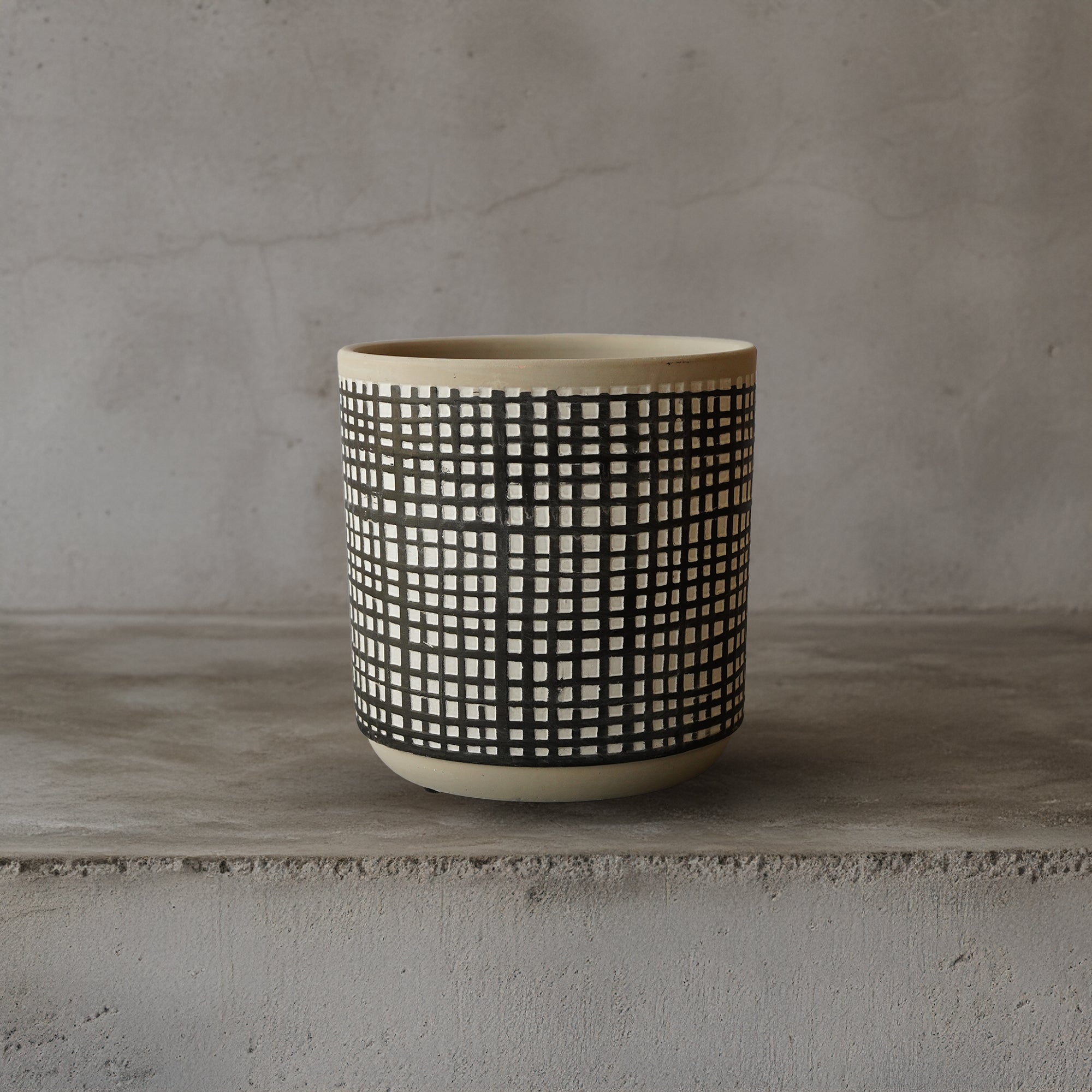 Black cement planter box with classic checkered pattern, suitable for outdoor or indoor use, by BEACON in the planter boxes collection.