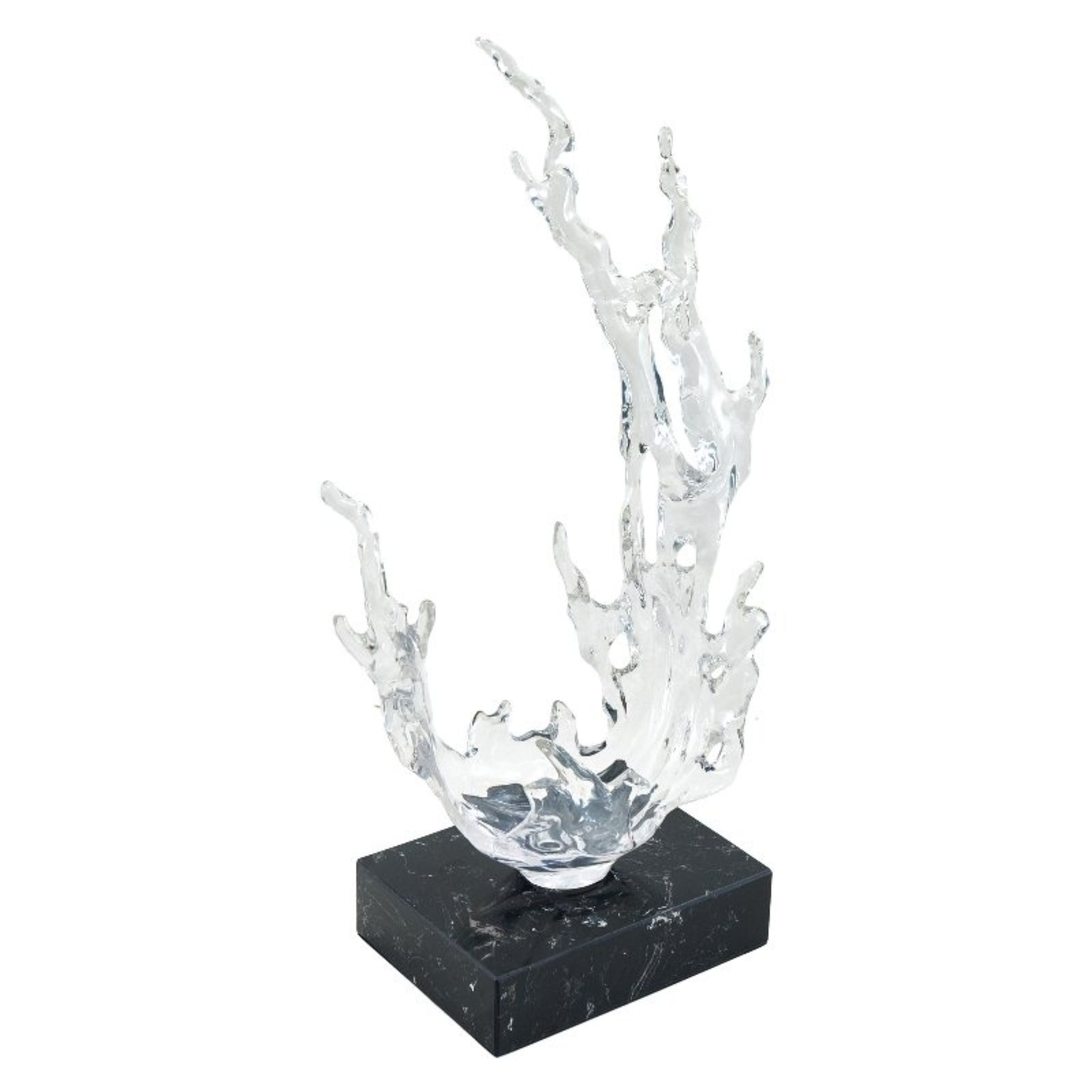 Clear abstract sculpture from Beacon home decor figurines, modern glass art piece with sleek, artistic design.