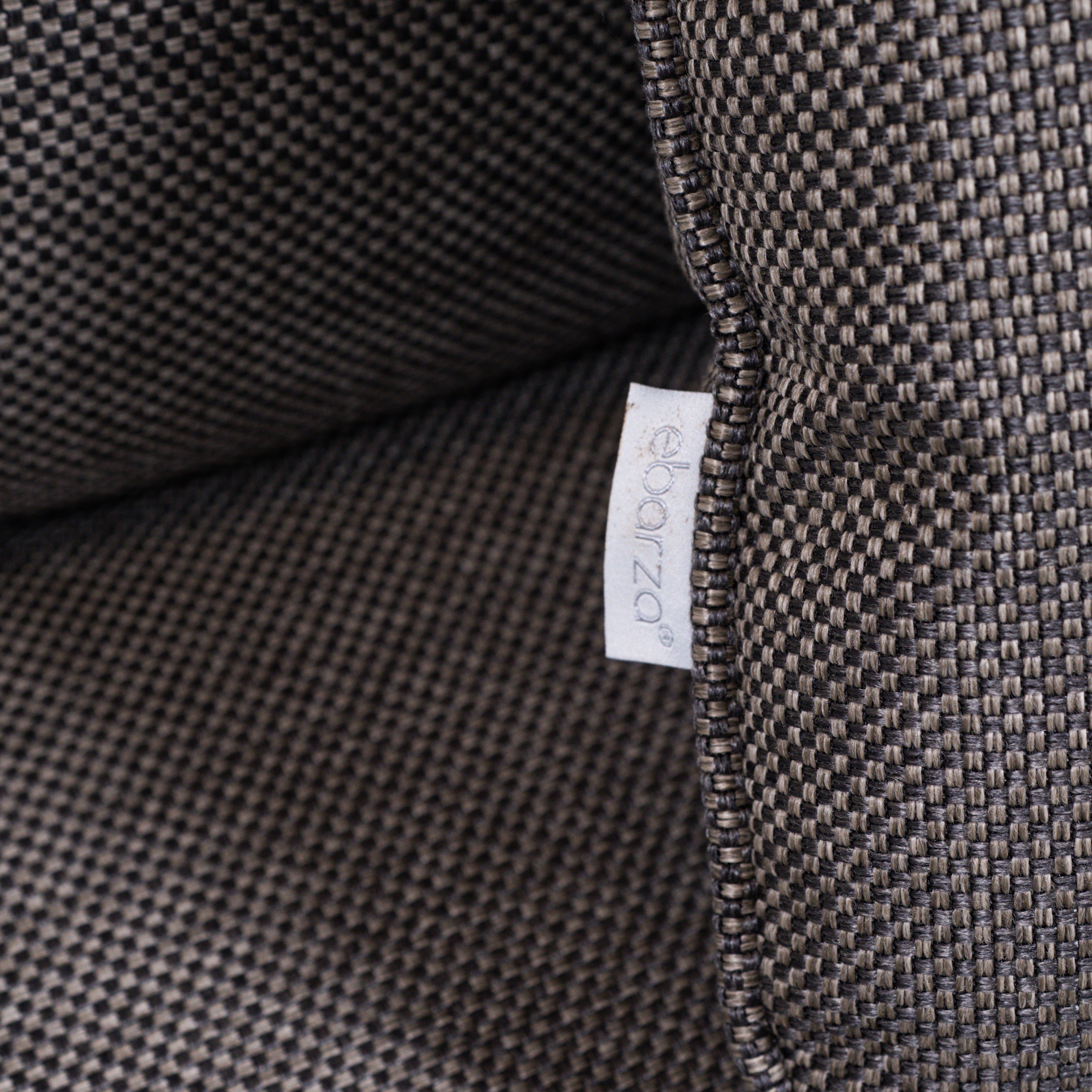 Beacon Clogs lounge chair with seat and back cushions, modern armchair with plush upholstery and stylish design.